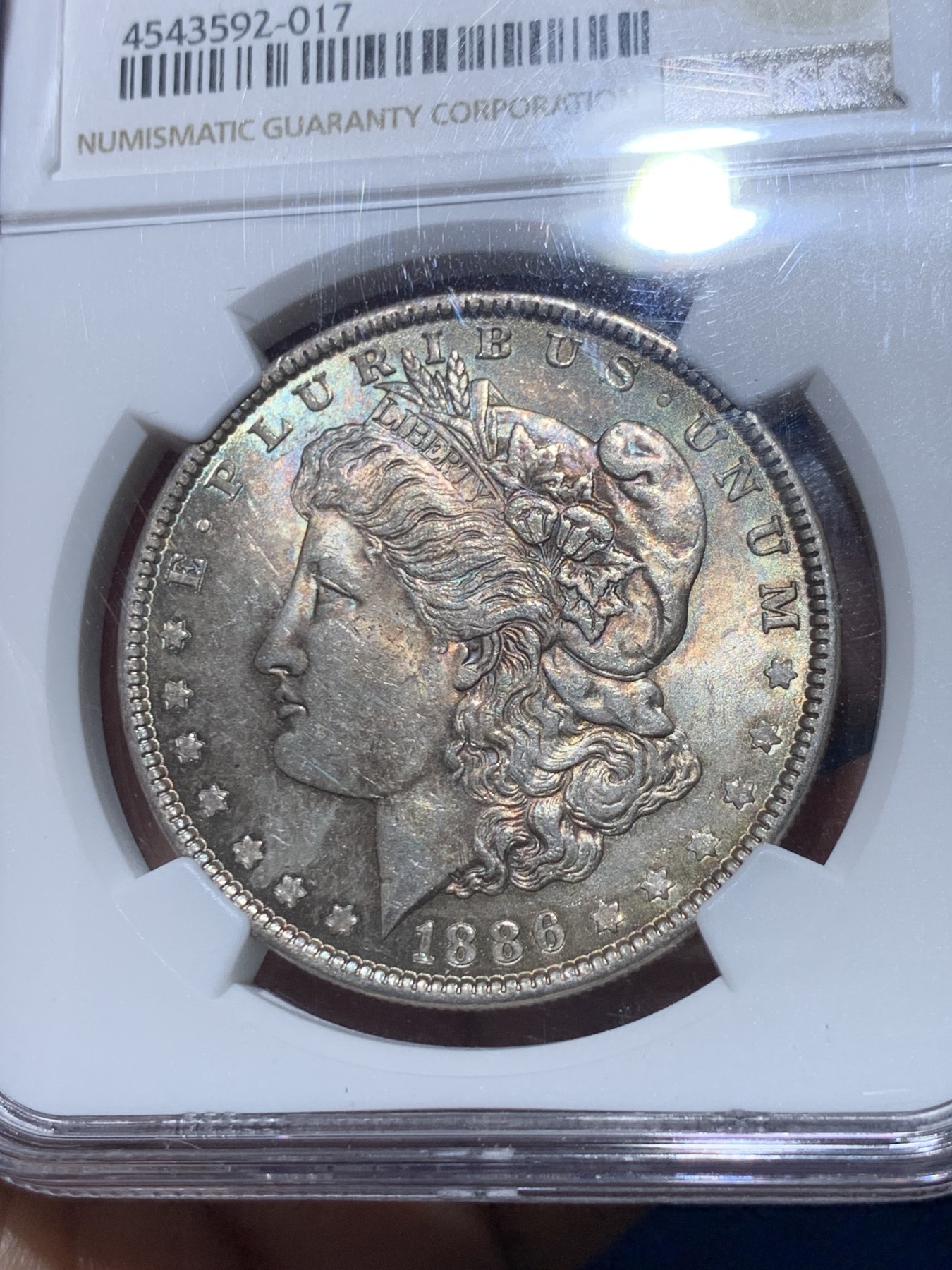 《竞宝斋》第257场-周日，周一 2场连拍 (全场包邮) NGC MS64 美国1886年摩根银币，双面五彩老包浆，转光明显，状态和品质秒杀绝大部分MS64。