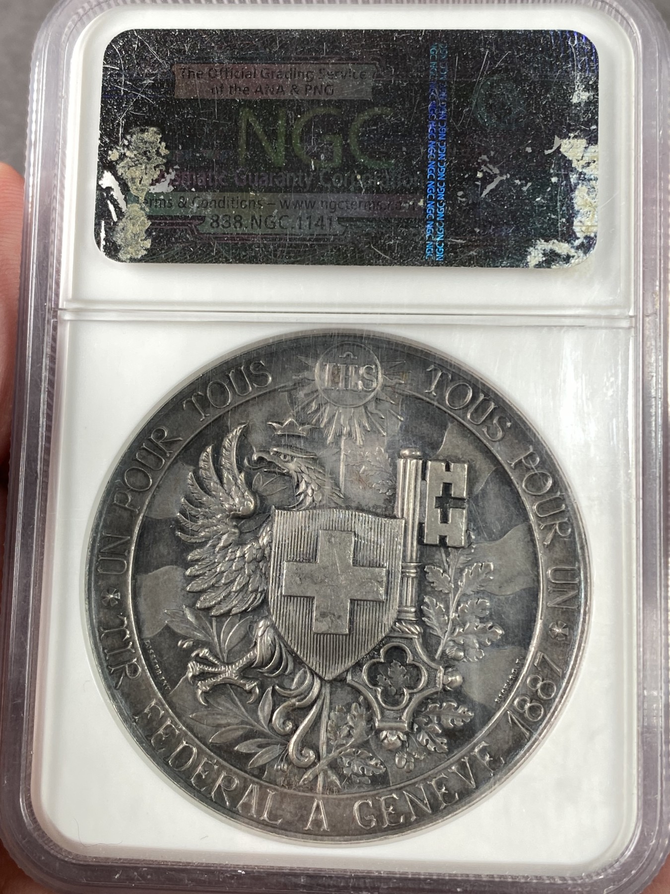 万国钱币拍卖第023期（金辉银韵之夜） NGC MS64 1887瑞士日内瓦射击节大银章，超高浮雕，顶级品相。