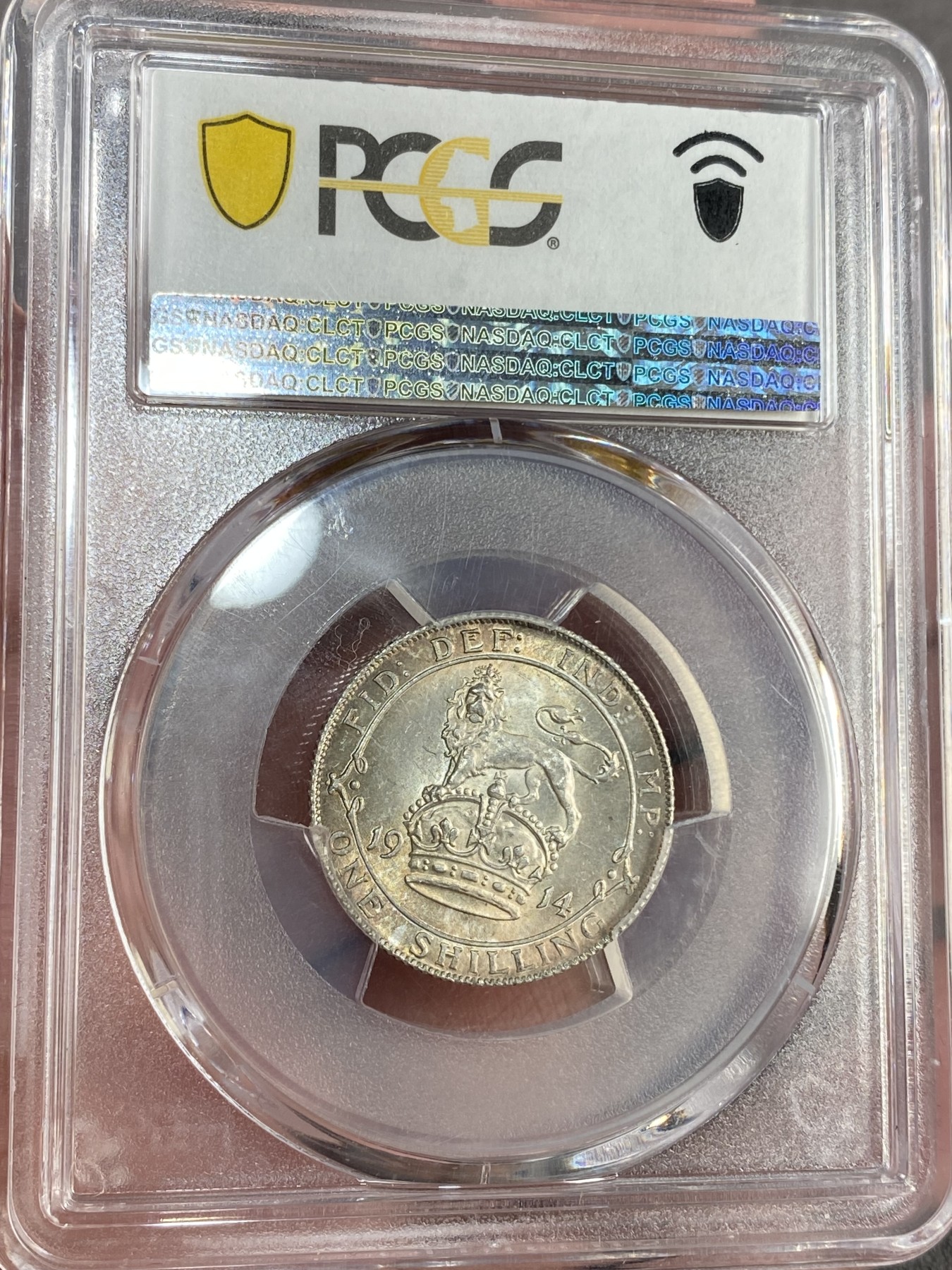 万国钱币拍卖第023期（金辉银韵之夜） PCGS MS64+ 1914英国乔治五世1先令 五彩转光。