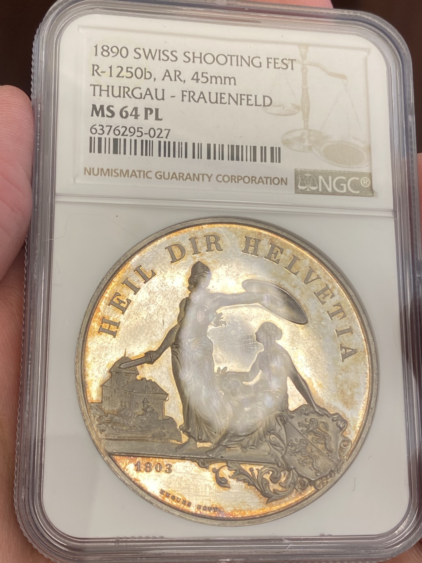万国钱币拍卖第023期（金辉银韵之夜） NGC MS64PL 1890瑞士图尔高射击节大银章 完美的镜面，完美的包浆，一切都是那么恰到好处。