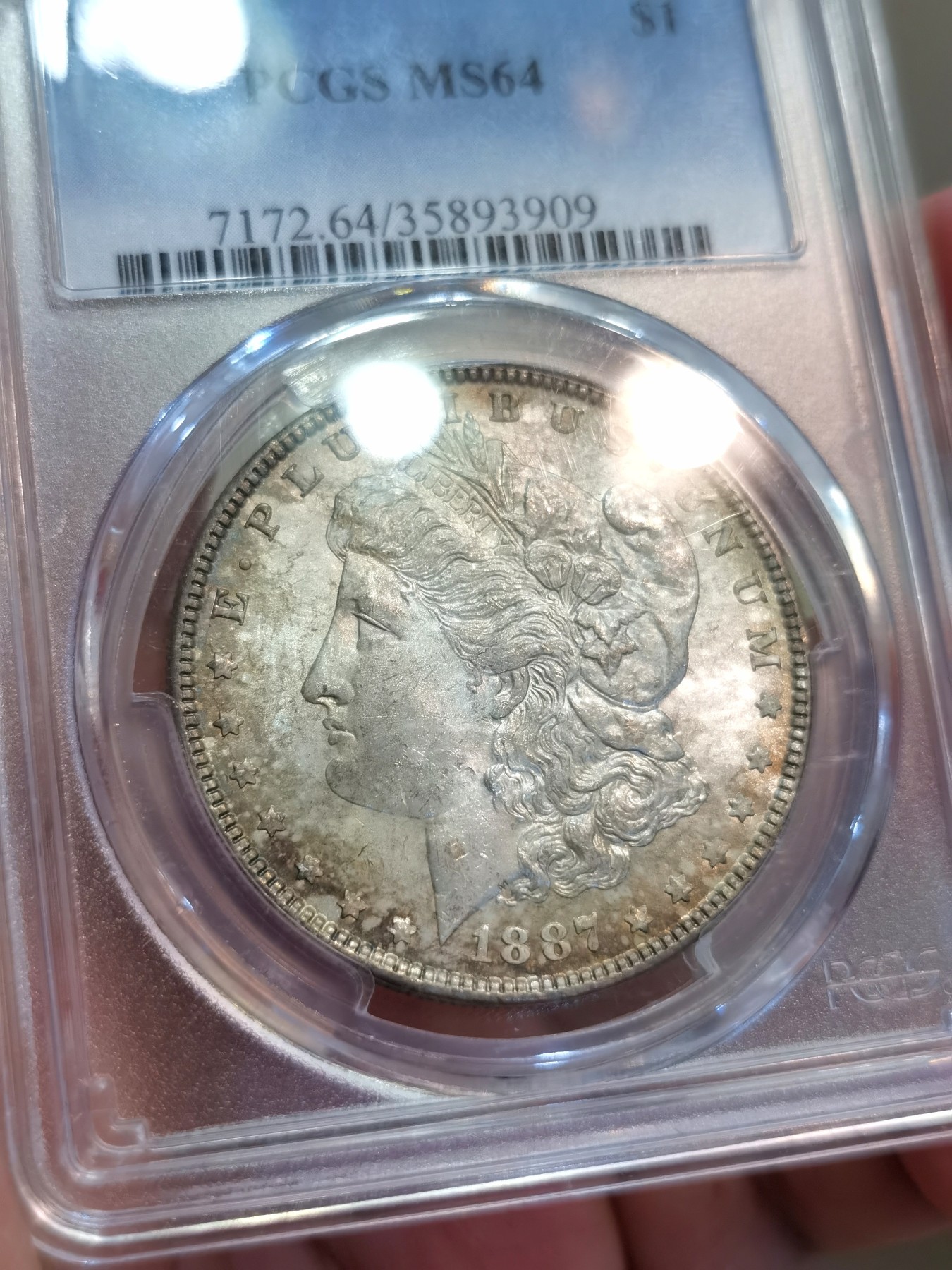 博洋堂世界钱币拍卖第086期（全场包邮） PCGS MS64 美国1887年P版摩根银币，双面绚丽五彩包浆，彩浆层次分明，3号段老盒严评
