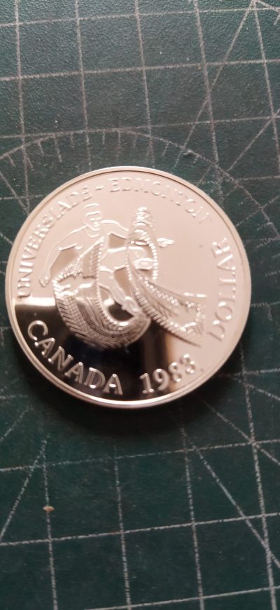 外国硬币初藏2024年第9场 - 加拿大1元1983年埃德蒙顿大学运动会精制纪念银币。未用