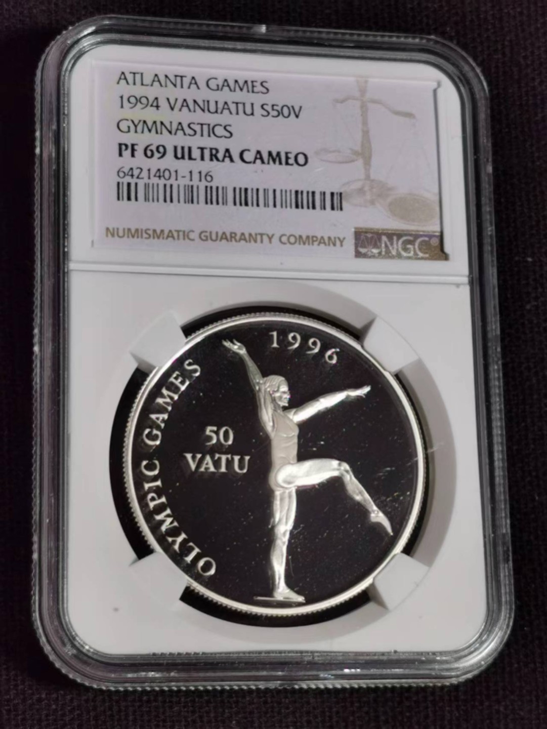 刘世昌艺术品销售中心～虎踞龙蟠*金杨在线联拍群第510期  瓦努阿图1994年50瓦图亚特兰大奥运会～艺术体操精制纪念银币（NGC PF69UC 串号：6421401-116）1枚。