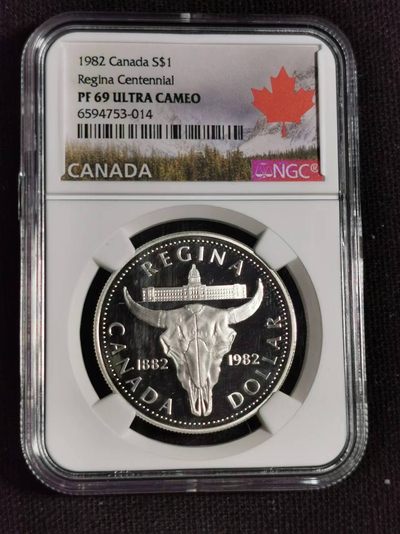 刘世昌艺术品销售中心～虎踞龙蟠*金杨在线联拍群第508期 - 加拿大1982年“里贾纳建市一百周年～牛头”精制纪念银币（NGC PF69UC 串号：6594753-014）1枚。