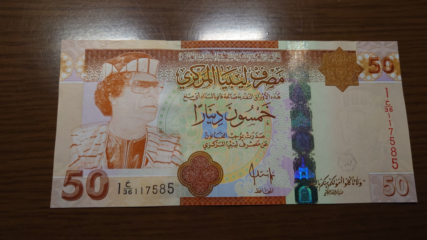 【世界钱币】精选微拍第101期暨2024年第12期  部分卖剩的新品裸钞评级币展销 【一口价已售出】利比亚50第纳尔 卡扎菲 全新绝品无4尾号7585