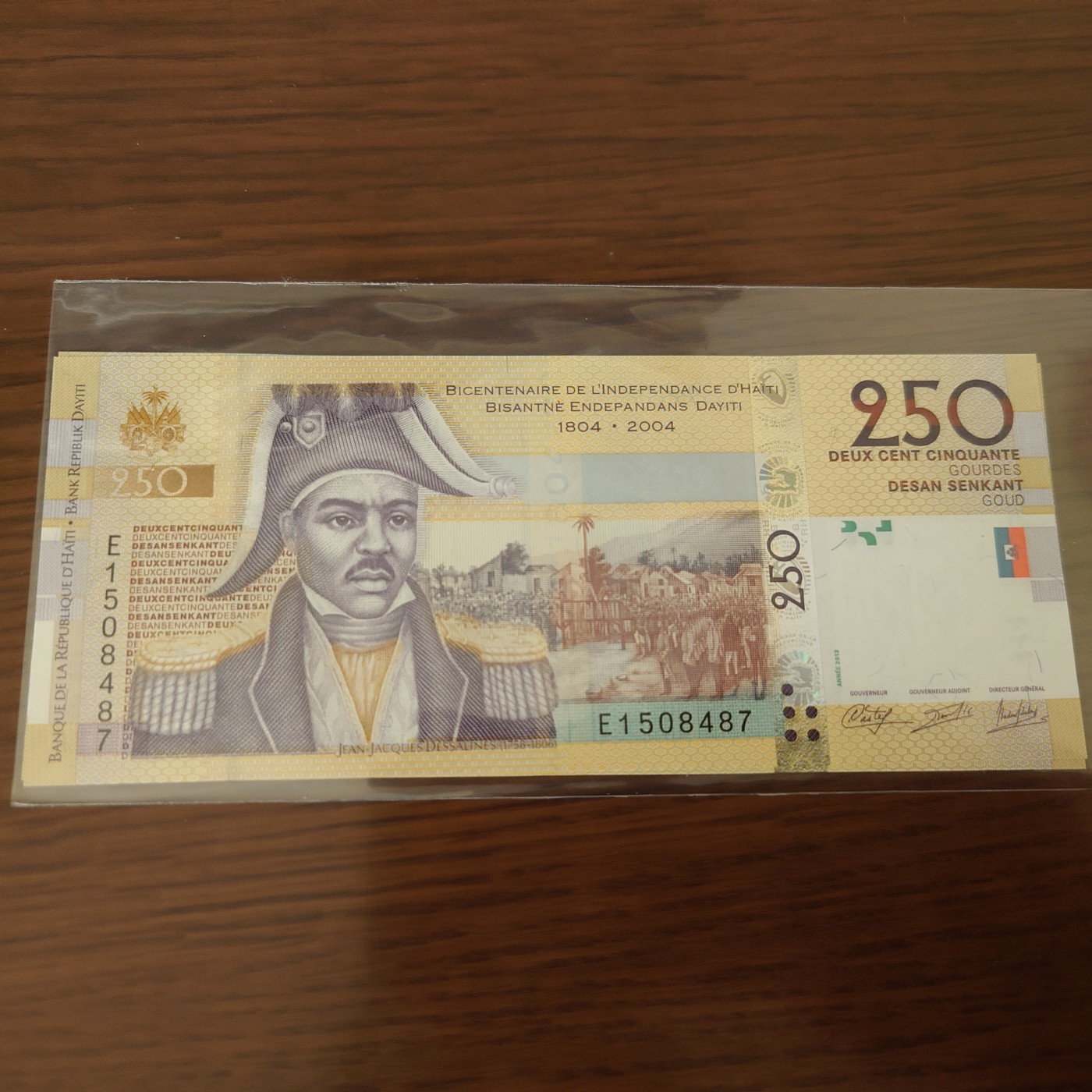 【世界钱币】精选微拍第102期暨2024年第13期  部分卖剩货品继续拍 海地250古德 E冠全新绝品尾号487