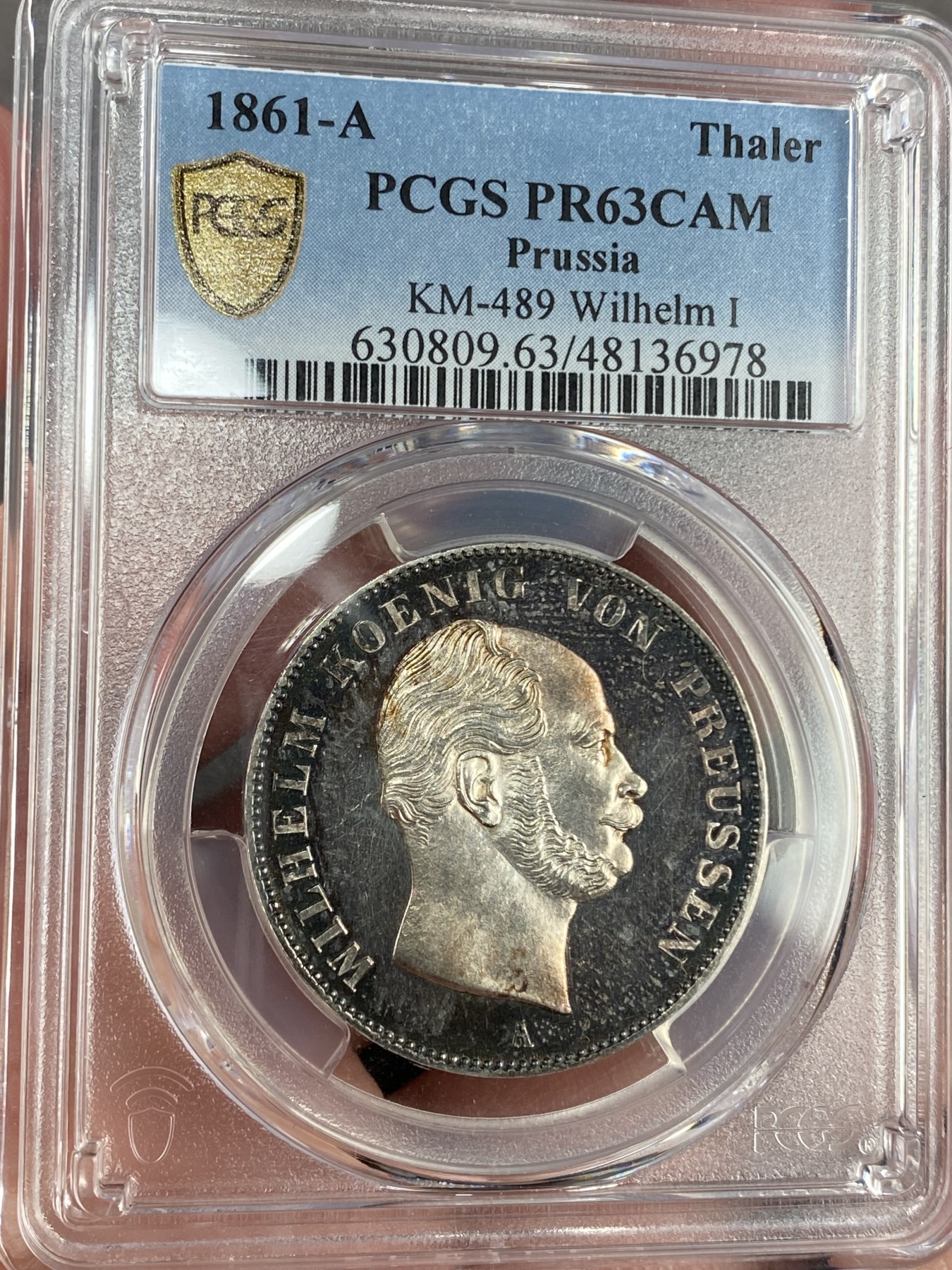 万国钱币拍卖第024期（诸神之战） PCGS PR63CAM 1861年德国威廉一世离冠鹰加冕首年流通1泰勒 精致深度镜面 唯一亚军分数 评级为PRCAM总共两枚 是早期威廉一世经典中的精品 近200年的深五彩 不可多得的尤物 近期欧拍一枚精致离冠2泰勒已过10w