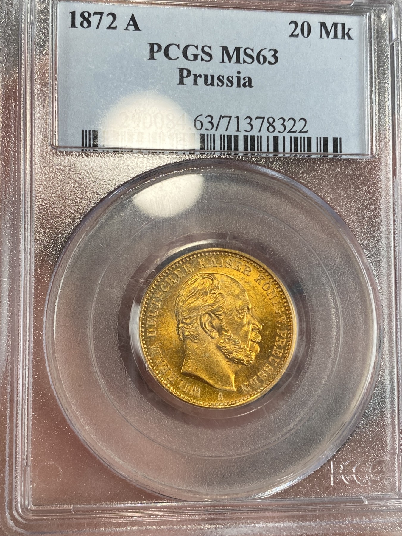 万国钱币拍卖第024期（诸神之战） PCGS MS63 1872年德国普鲁士威廉一世短翅20马克金币 经典品种配经典PC白盒，状态喜人，应该有得+，好品非常难得的短翅金马克，更高分仅9枚，7.96g，900金。