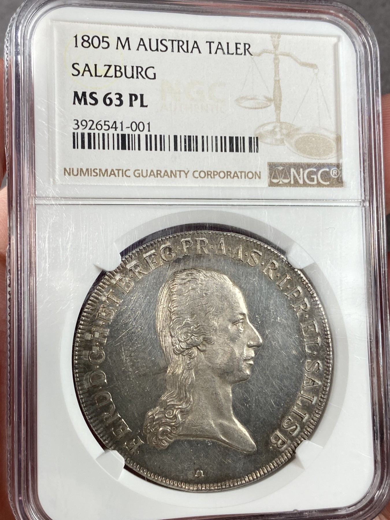 万国钱币拍卖第024期（诸神之战） NGC MS63PL 1805年奥地利弗朗茨二世萨尔茨堡盾徽大泰勒 1805年第三次反法同盟战争失败 根据普雷斯堡和约 萨尔茨堡选侯国由奥地利吞并 并发行了此枚泰勒 完美的倒影包浆显示出它从未被动过的原始一手状态 proof like展现了它如丝绸般顺滑的镜面底板