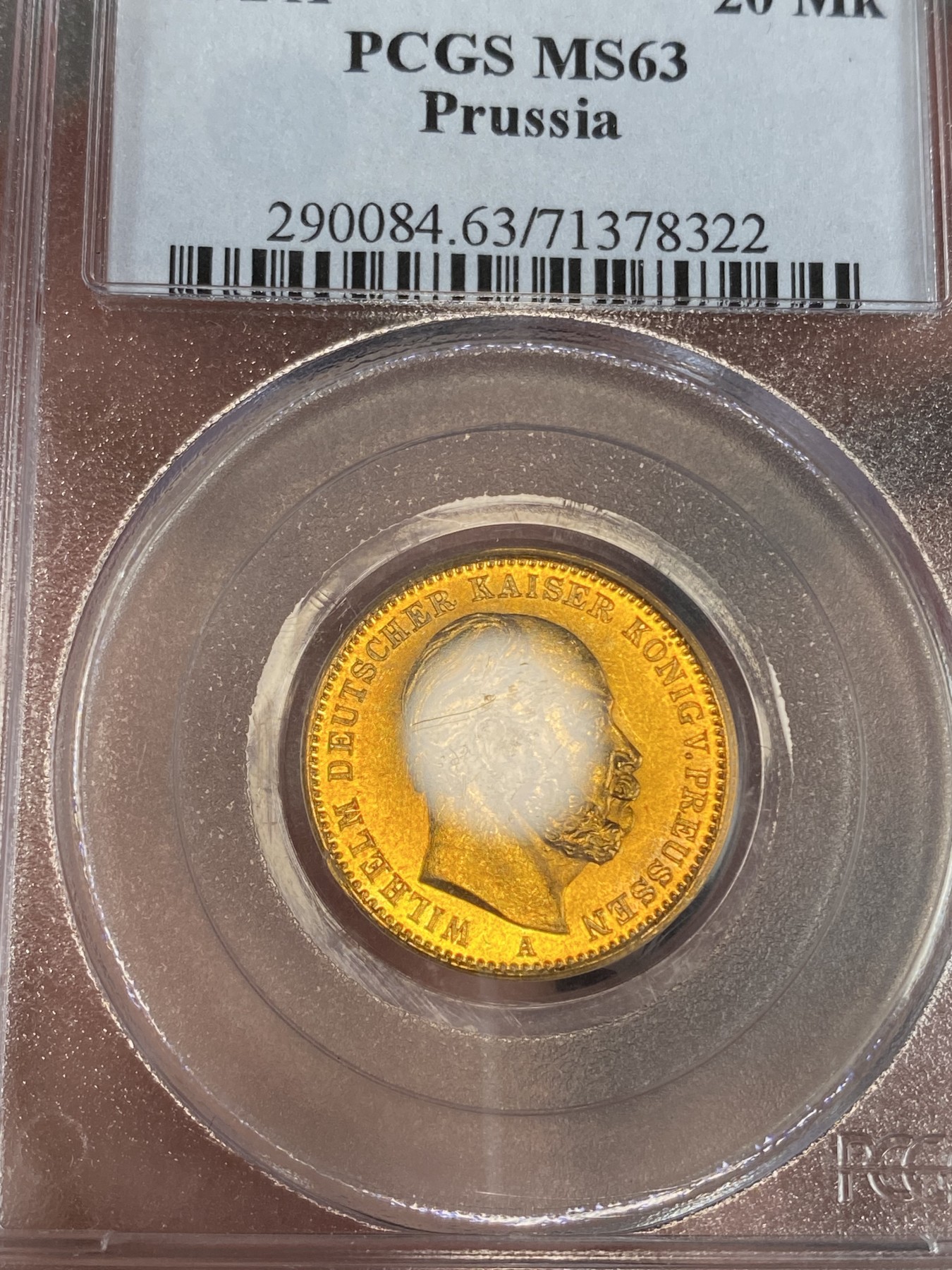 万国钱币拍卖第024期（诸神之战） PCGS MS63 1872年德国普鲁士威廉一世短翅20马克金币 经典品种配经典PC白盒，状态喜人，应该有得+，好品非常难得的短翅金马克，更高分仅9枚，7.96g，900金。