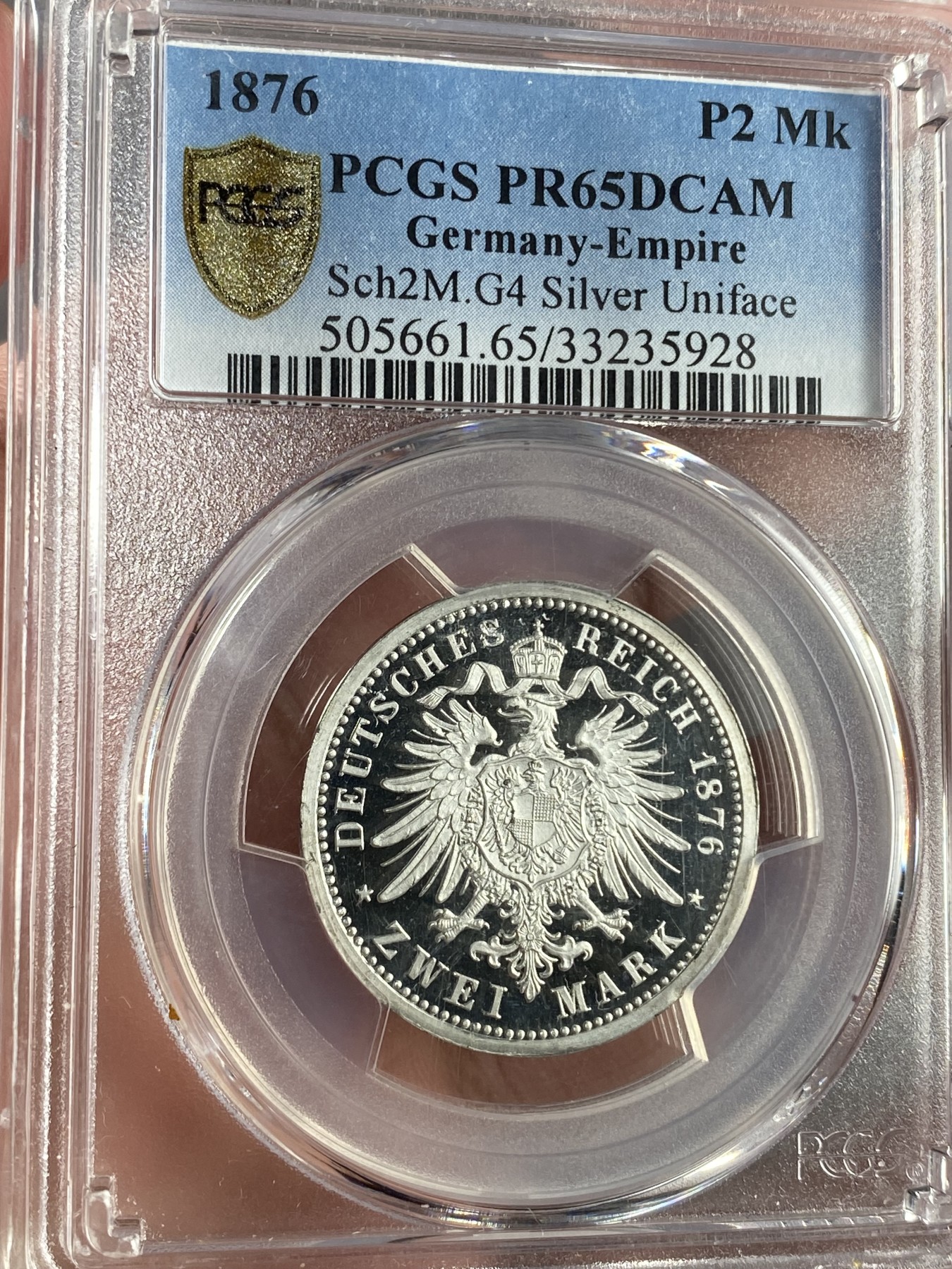 万国钱币拍卖第024期（诸神之战） PCGS PR65DCAM 1876德国2马克单面银样币 介于短翅和长翅之间的一种鹰型，完美镜面喷砂状态，银样罕见，马克进阶玩家不容错过的一枚。