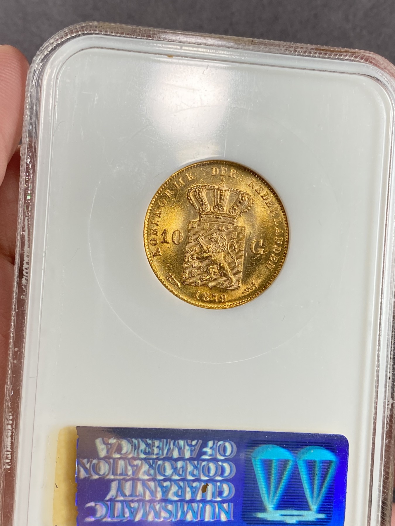 万国钱币拍卖第024期（诸神之战） NGC MS66 1879年荷兰王国威廉三世10盾金币 顶级品相 金光灿灿 6.73g，900金。