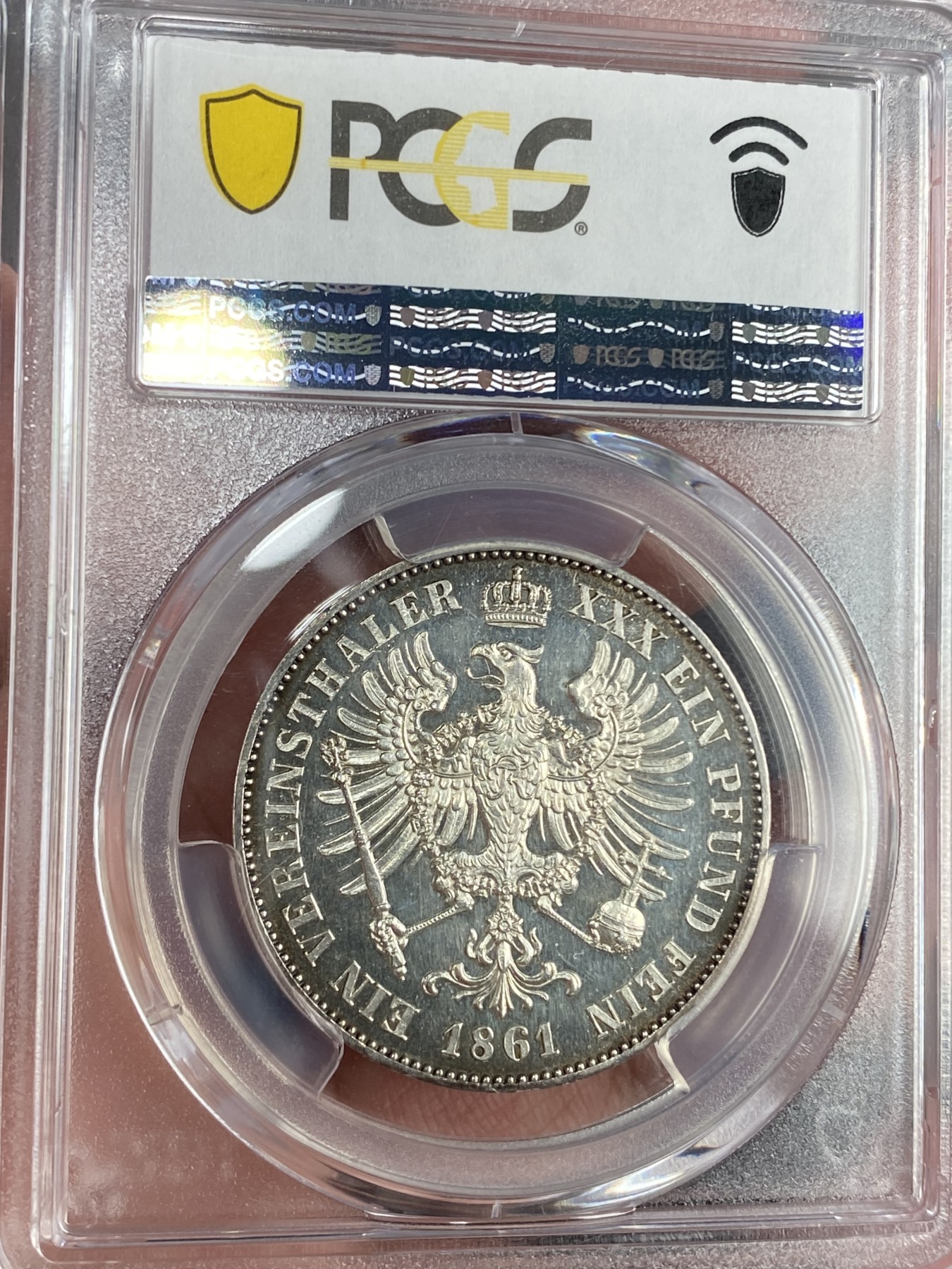 万国钱币拍卖第024期（诸神之战） PCGS PR63CAM 1861年德国威廉一世离冠鹰加冕首年流通1泰勒 精致深度镜面 唯一亚军分数 评级为PRCAM总共两枚 是早期威廉一世经典中的精品 近200年的深五彩 不可多得的尤物 近期欧拍一枚精致离冠2泰勒已过10w