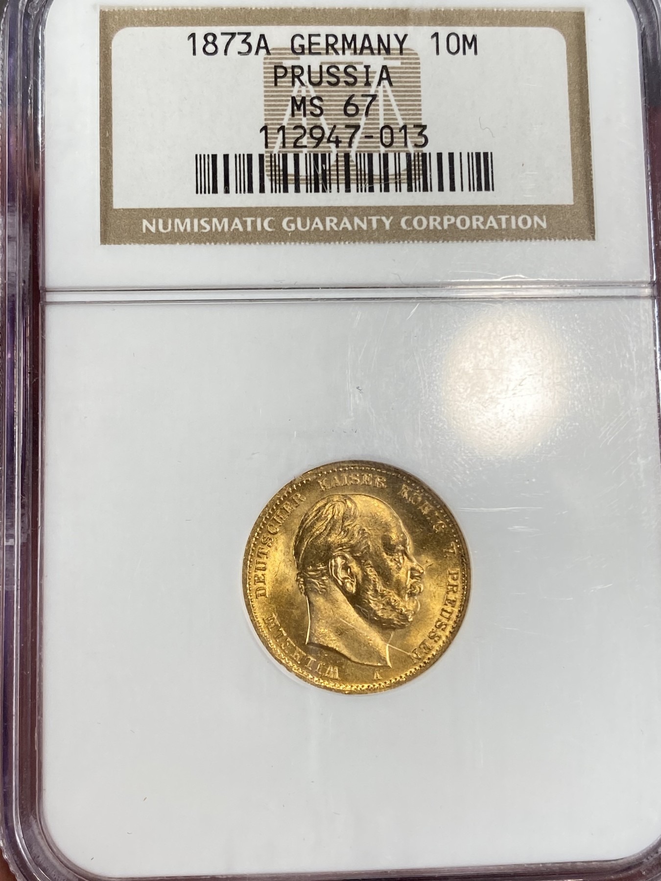 万国钱币拍卖第024期（诸神之战） NGC MS67 1873年德国普鲁士威廉一世短翅10马克金币 经典NGC老白盒，刚出厂的状态无需多言，3.98g，900金。