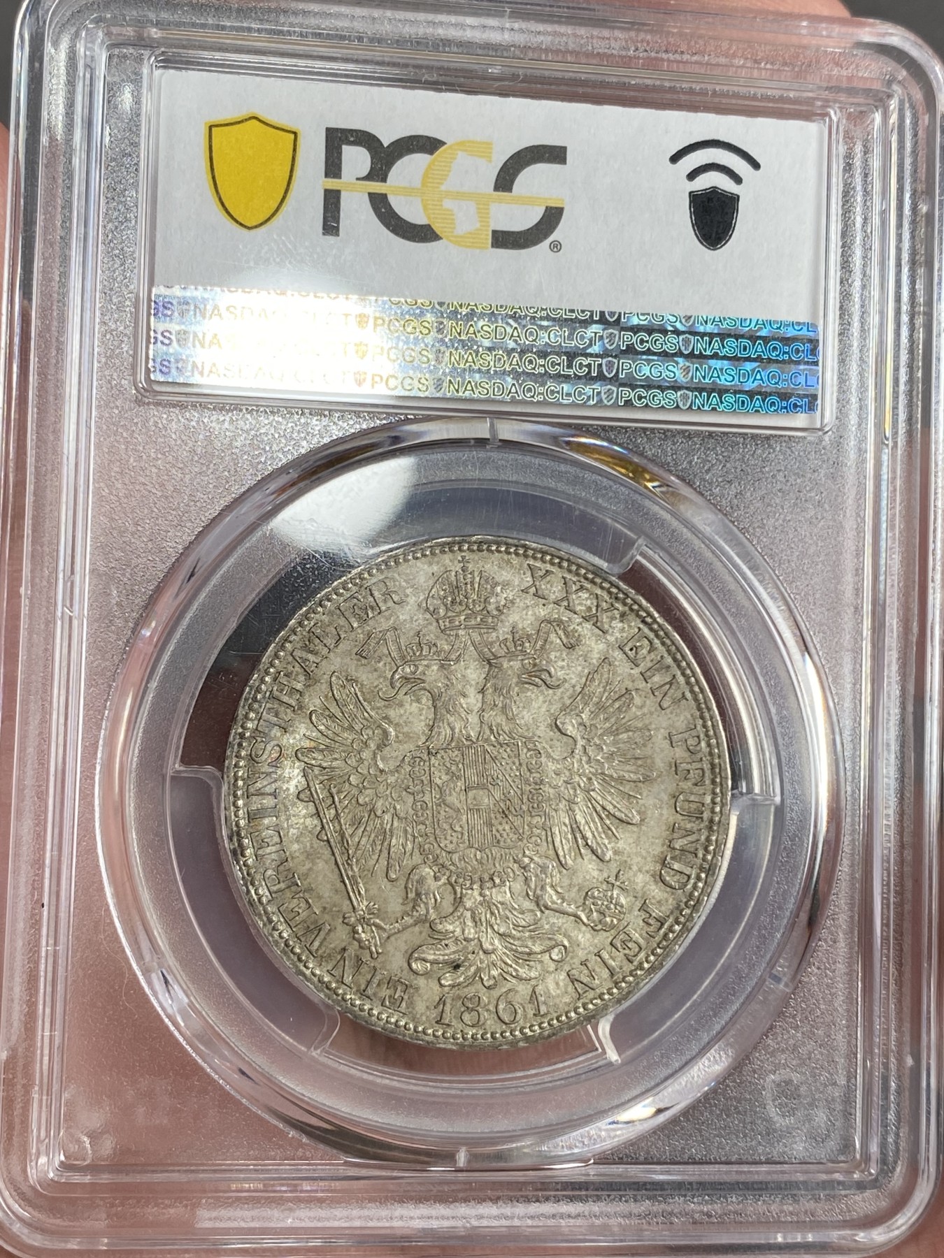 万国钱币拍卖第024期（诸神之战） PCGS MS63 1861年奥地利佛朗茨一世双头鹰流通1泰勒 PC唯一亚军分 更高分仅一枚 重五彩 属德意志联合泰勒范畴 奥地利潜力品种