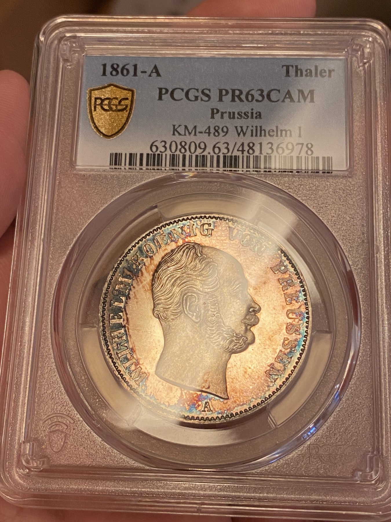万国钱币拍卖第024期（诸神之战） PCGS PR63CAM 1861年德国威廉一世离冠鹰加冕首年流通1泰勒 精致深度镜面 唯一亚军分数 评级为PRCAM总共两枚 是早期威廉一世经典中的精品 近200年的深五彩 不可多得的尤物 近期欧拍一枚精致离冠2泰勒已过10w