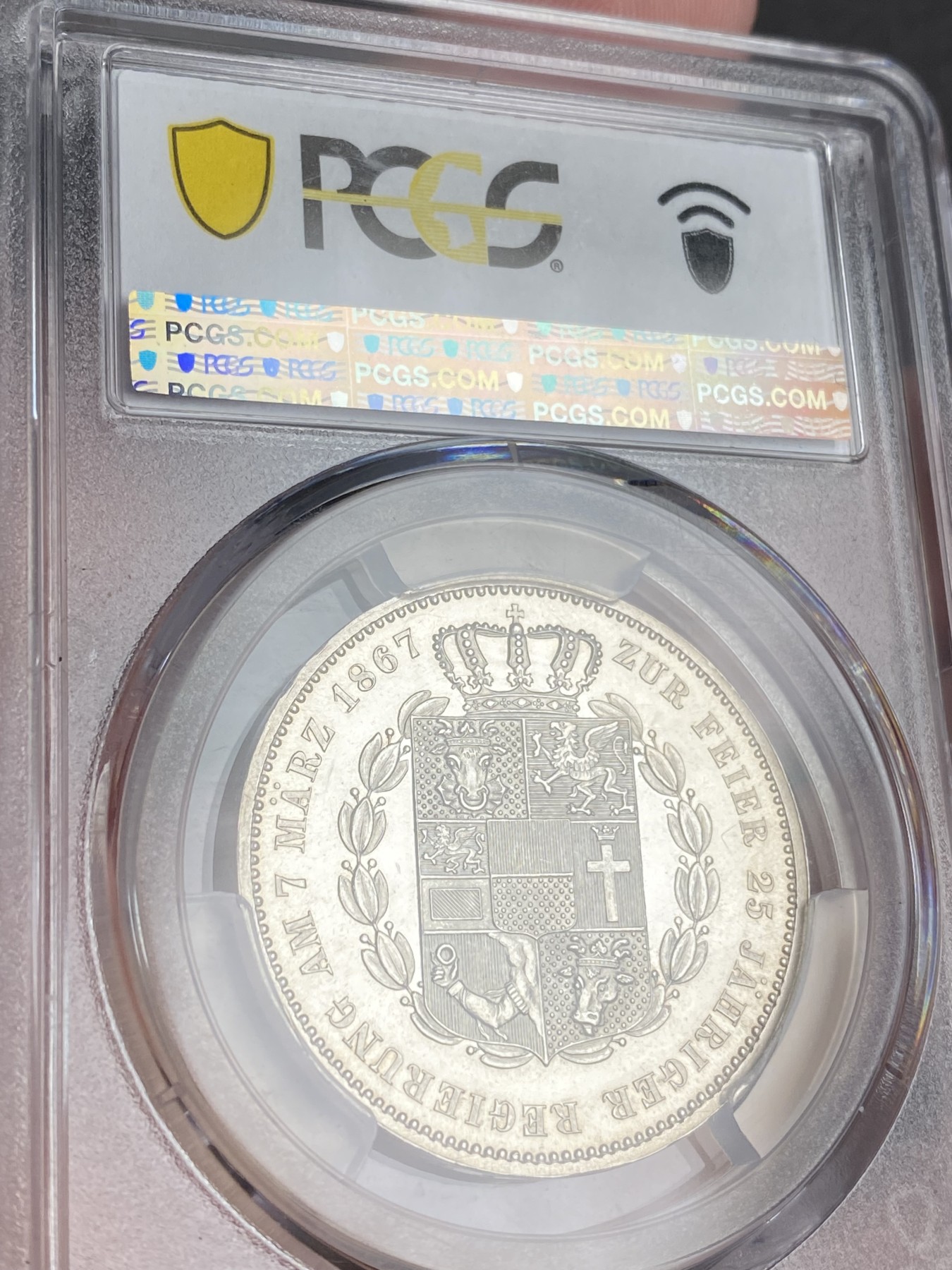 万国钱币拍卖第024期（诸神之战） PCGS PR63CAM 1867德国梅克伦堡精制纹章1泰勒 好品难得的小邦品种，精制CAM更是凤毛麟角，喷砂质感的纹章搭配上镜面感极强的底板实在是赏心悦目。