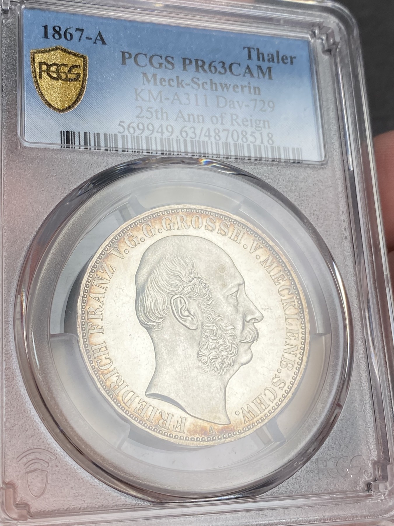 万国钱币拍卖第024期（诸神之战） PCGS PR63CAM 1867德国梅克伦堡精制纹章1泰勒 好品难得的小邦品种，精制CAM更是凤毛麟角，喷砂质感的纹章搭配上镜面感极强的底板实在是赏心悦目。