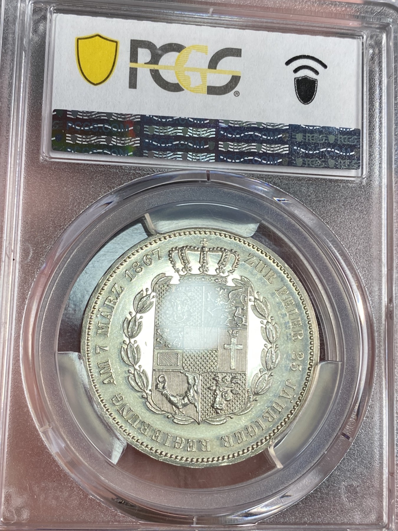万国钱币拍卖第024期（诸神之战） PCGS PR63CAM 1867德国梅克伦堡精制纹章1泰勒 好品难得的小邦品种，精制CAM更是凤毛麟角，喷砂质感的纹章搭配上镜面感极强的底板实在是赏心悦目。