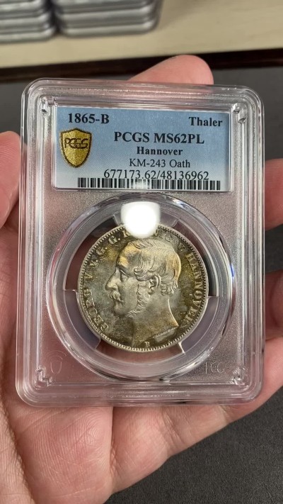 万国钱币拍卖第024期（诸神之战） PCGS MS62PL 1865年德国汉诺威橡树箴言1泰勒 近几年很难再见到BU品质 2000的发行量使得大部分高品都被珍藏住 此枚浑身金彩 高点锋利如刀 绝对是一枚亦藏亦赏亦玩的选择