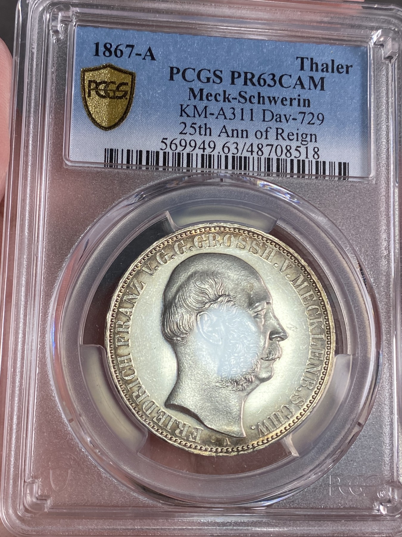 万国钱币拍卖第024期（诸神之战） PCGS PR63CAM 1867德国梅克伦堡精制纹章1泰勒 好品难得的小邦品种，精制CAM更是凤毛麟角，喷砂质感的纹章搭配上镜面感极强的底板实在是赏心悦目。