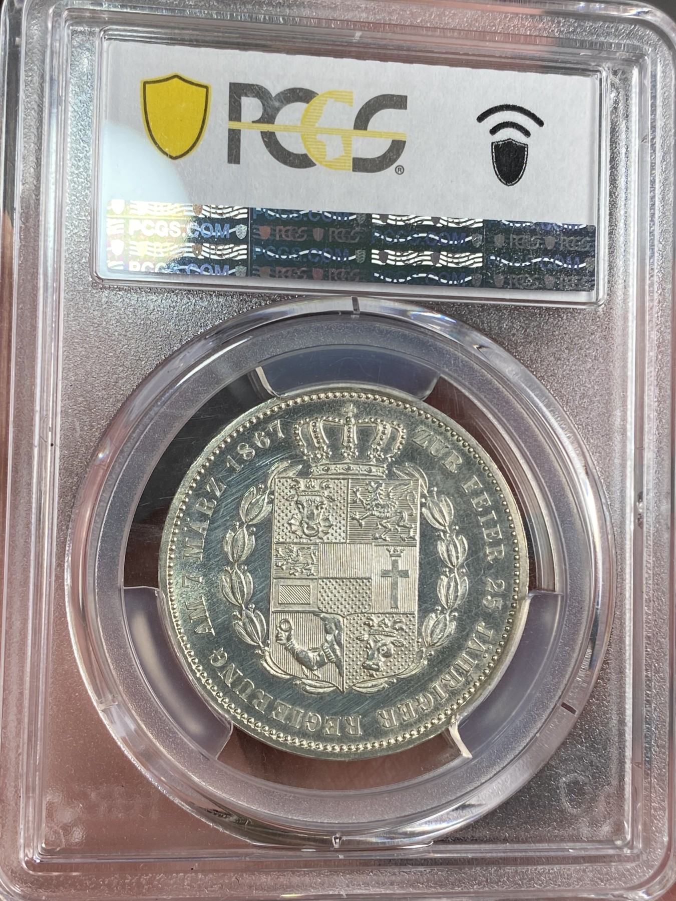 万国钱币拍卖第024期（诸神之战） PCGS PR63CAM 1867德国梅克伦堡精制纹章1泰勒 好品难得的小邦品种，精制CAM更是凤毛麟角，喷砂质感的纹章搭配上镜面感极强的底板实在是赏心悦目。