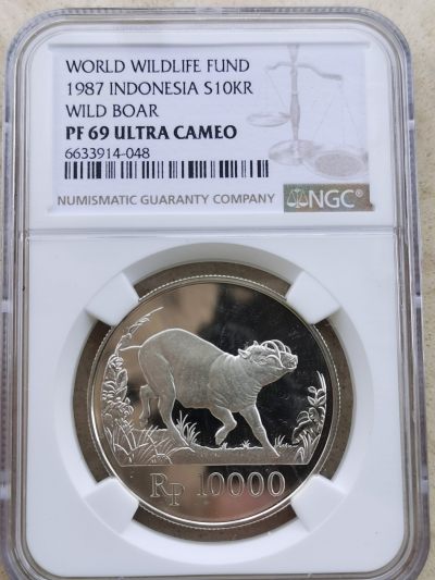 道一币馆币章第五十七场 - NGC pf69 印度尼西亚1987年野生动物-猪鹿10000卢比精制银币