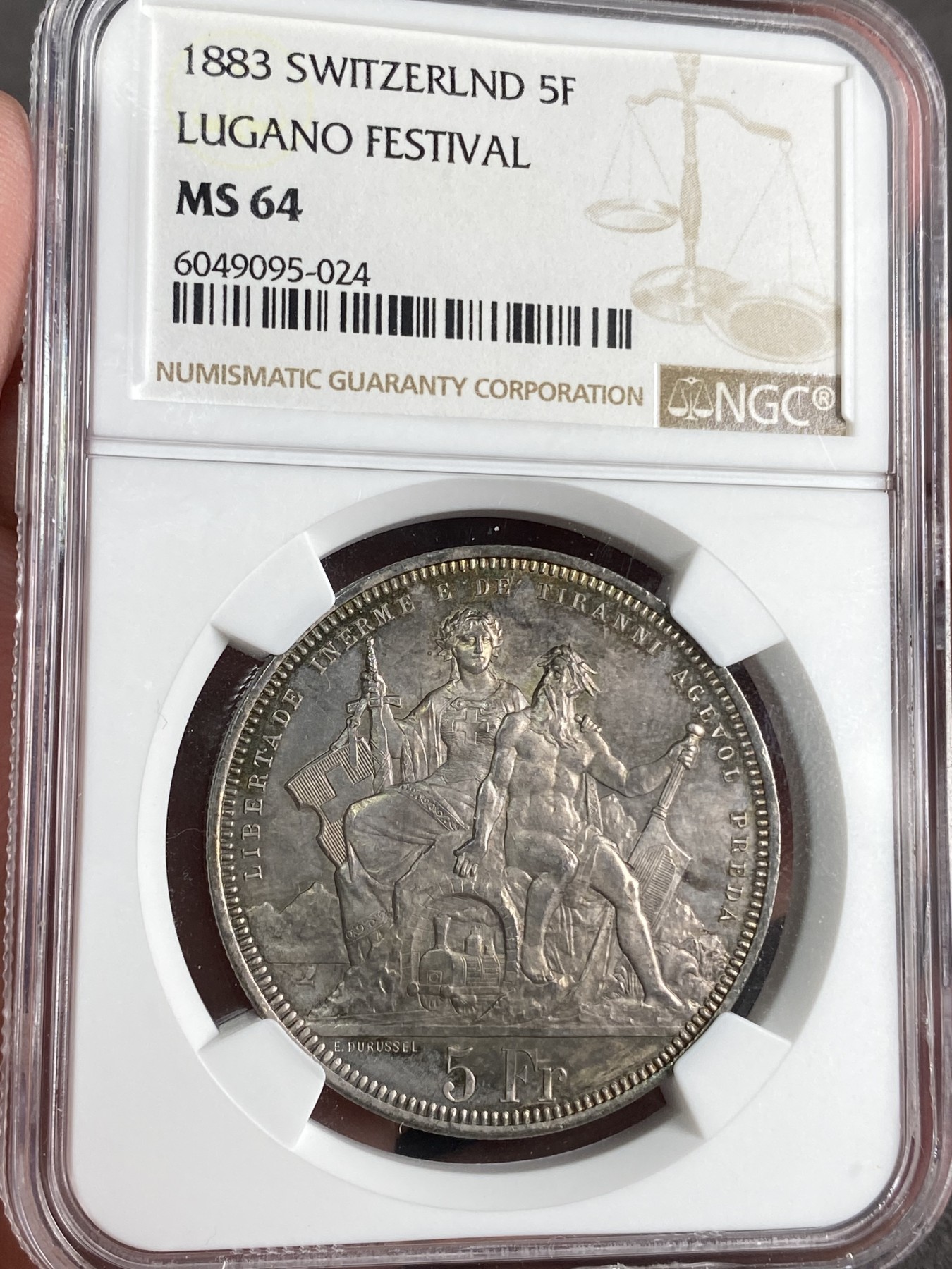 万国钱币拍卖第024期（诸神之战） NGC MS64 1883年瑞士卢加诺射击节5法郎大银币 渐变暗金色包浆 高分难得