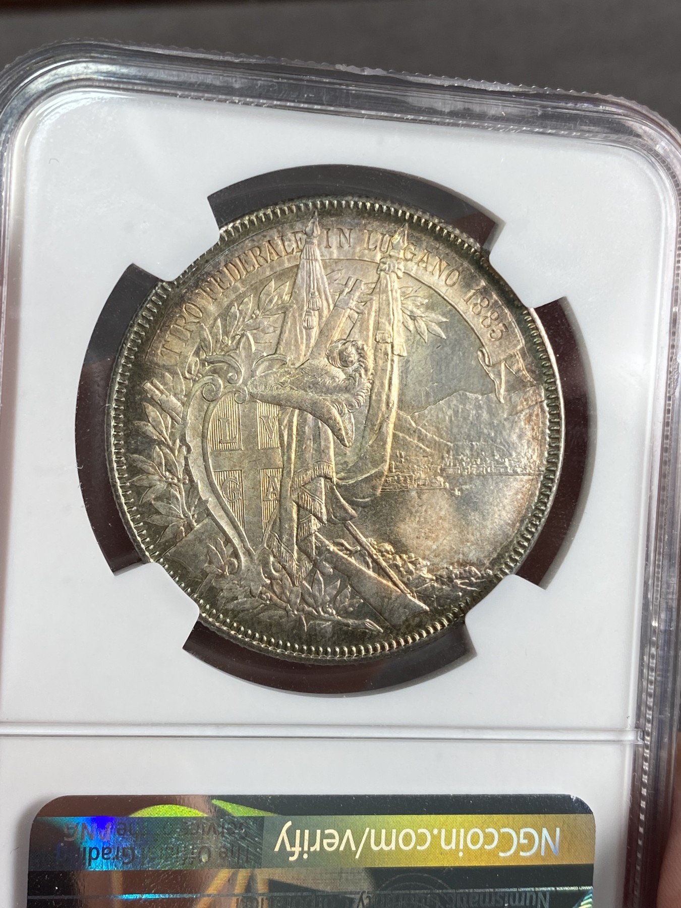 万国钱币拍卖第024期（诸神之战） NGC MS64 1883年瑞士卢加诺射击节5法郎大银币 渐变暗金色包浆 高分难得