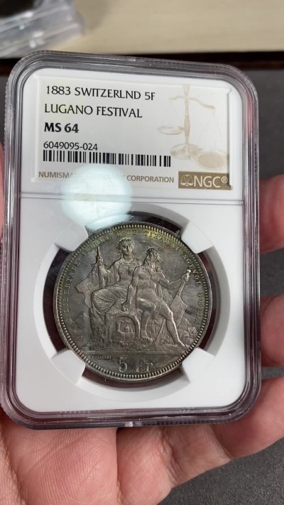 万国钱币拍卖第024期（诸神之战） NGC MS64 1883年瑞士卢加诺射击节5法郎大银币 渐变暗金色包浆 高分难得