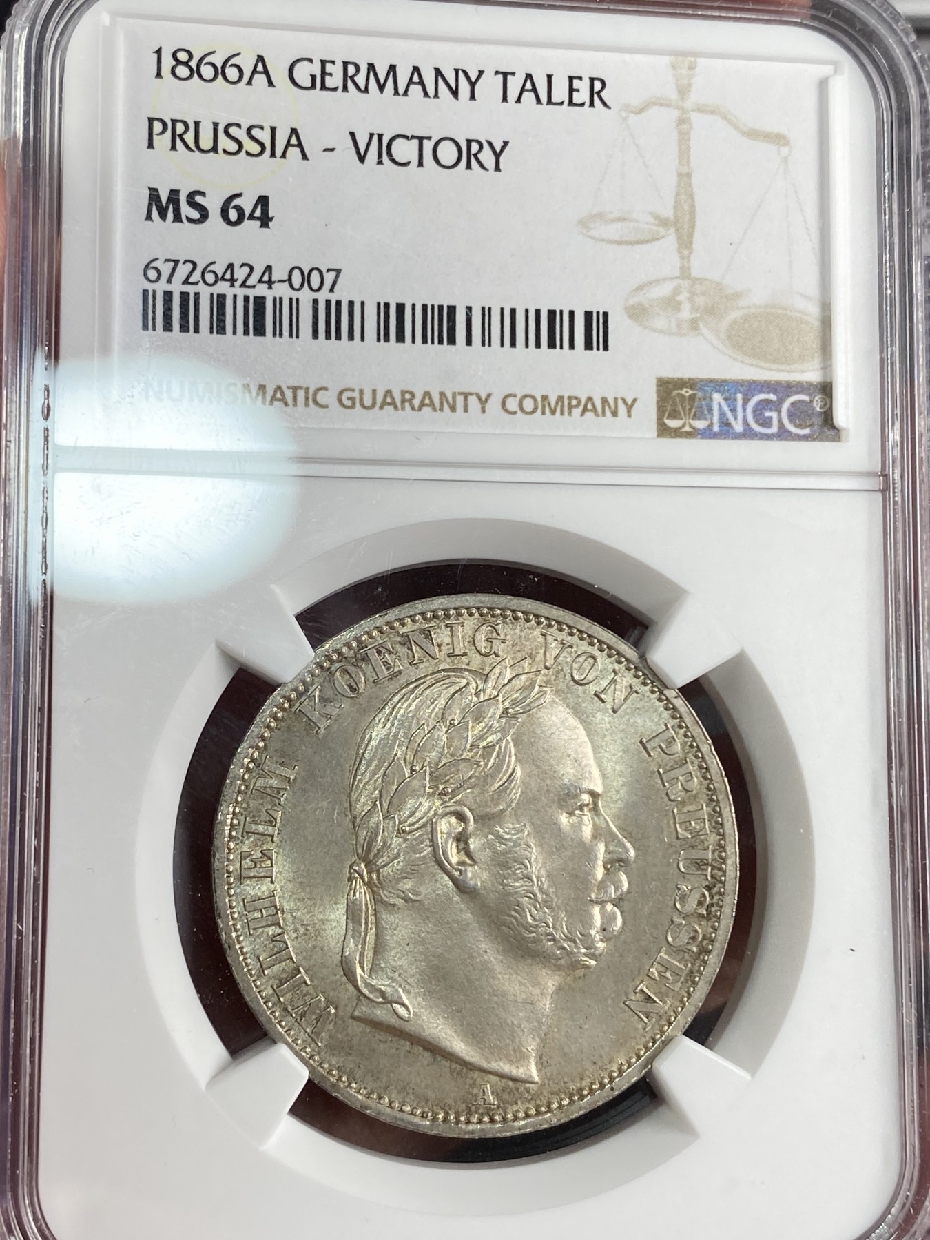 万国钱币拍卖第024期（诸神之战） NGC MS64 1866普鲁士普奥胜利泰勒 青色转光，bu品相。