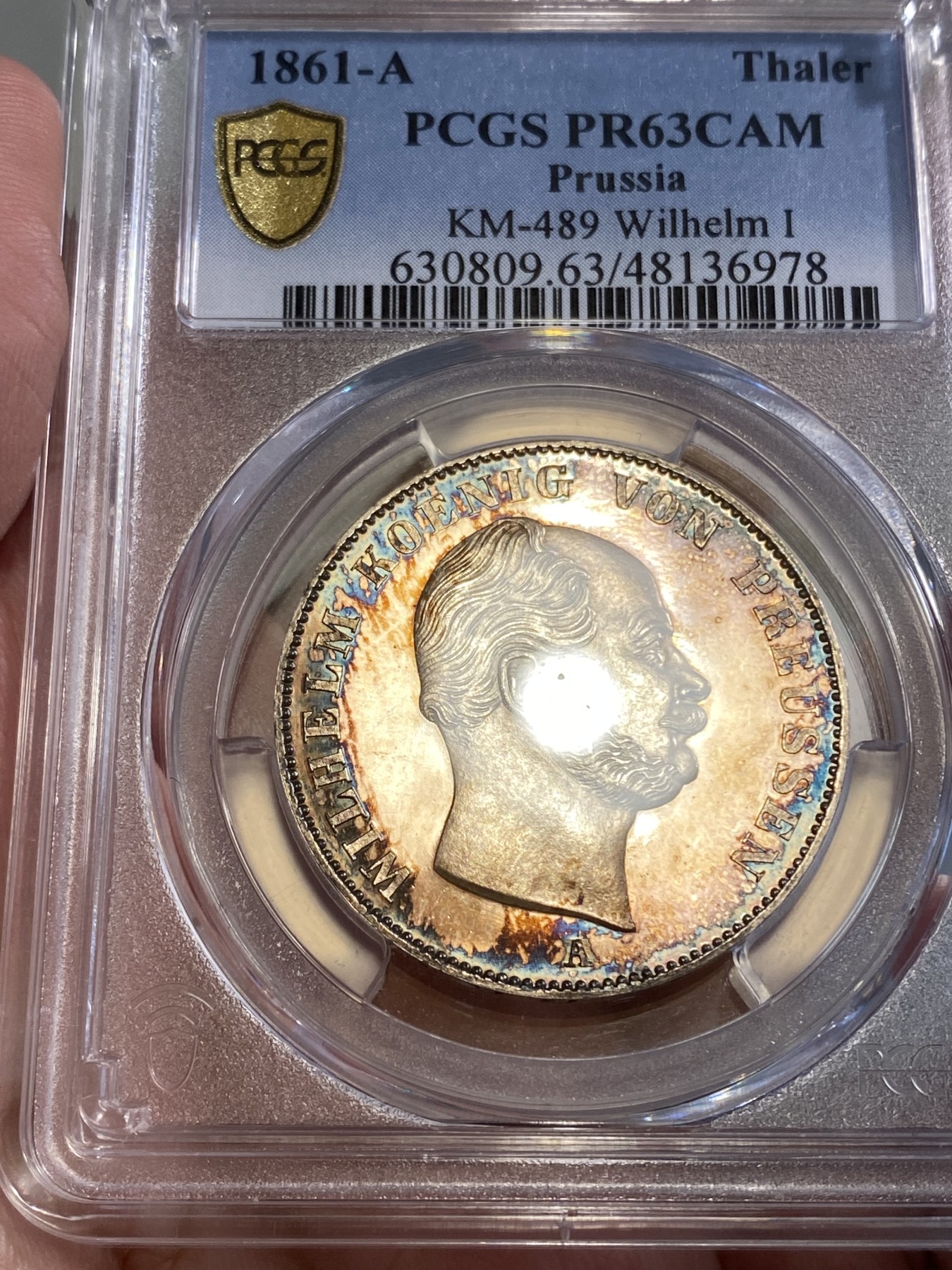万国钱币拍卖第024期（诸神之战） PCGS PR63CAM 1861年德国威廉一世离冠鹰加冕首年流通1泰勒 精致深度镜面 唯一亚军分数 评级为PRCAM总共两枚 是早期威廉一世经典中的精品 近200年的深五彩 不可多得的尤物 近期欧拍一枚精致离冠2泰勒已过10w