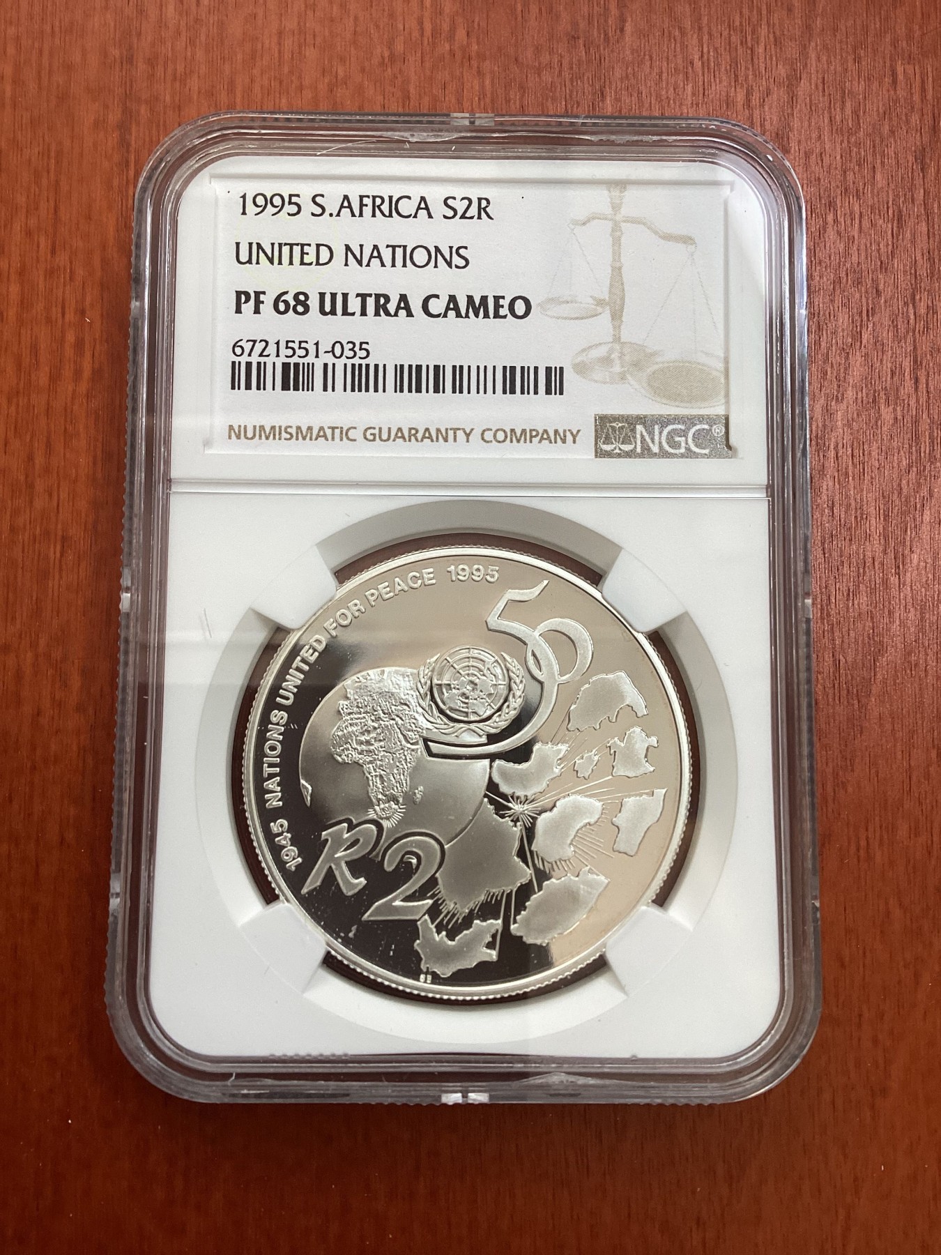 长老汇龙年精选第四场 1995 南非联合国成立五十周年2朗德精制银币，NGC PF68UC，季军分，发行量1412枚