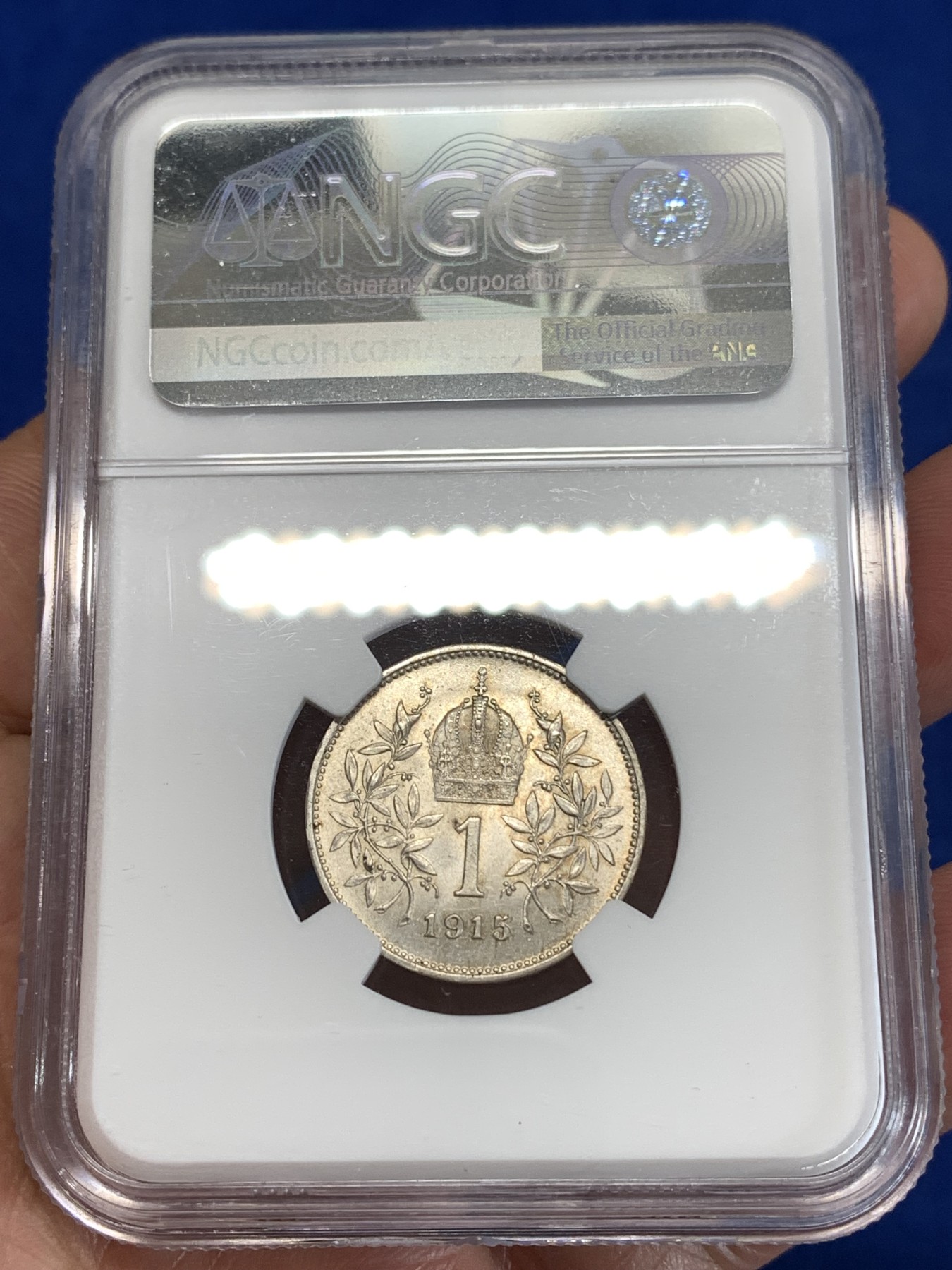 《竞宝斋》第263场-周日，周一 2场连拍 (全场包邮) NGC MS63 奥匈帝国1915年约瑟夫一世1克朗银币，金色包浆，十字转光