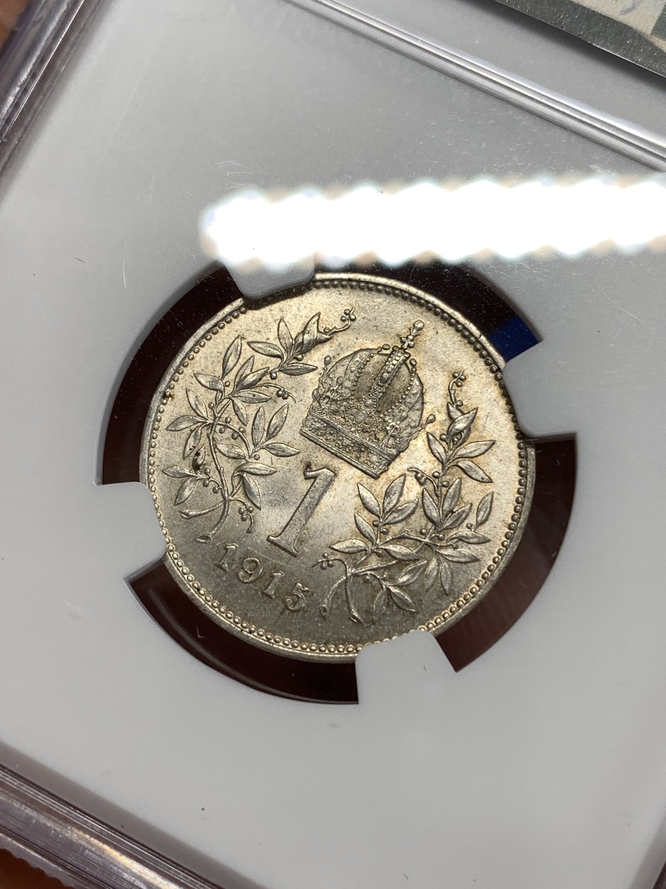 《竞宝斋》第263场-周日，周一 2场连拍 (全场包邮) NGC MS63 奥匈帝国1915年约瑟夫一世1克朗银币，金色包浆，十字转光