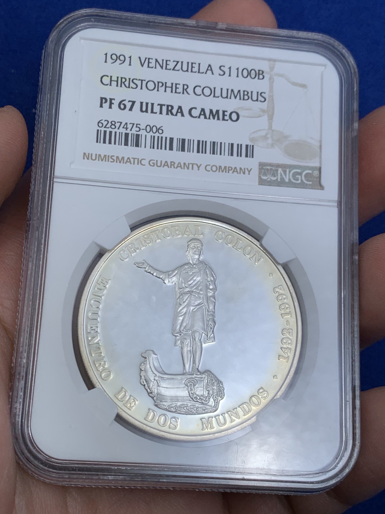 《竞宝斋》第263场-周日，周一 2场连拍 (全场包邮) NGC PF67UC 1991委内瑞拉1100玻利瓦尔银币，非常少见的委内瑞拉银币品种， 纪念哥伦布发现新大陆，正面是哥伦布全身像，背面是拉丁美洲各国国徽图案，委内瑞拉银币也是国际市场的热门品种，不容错过