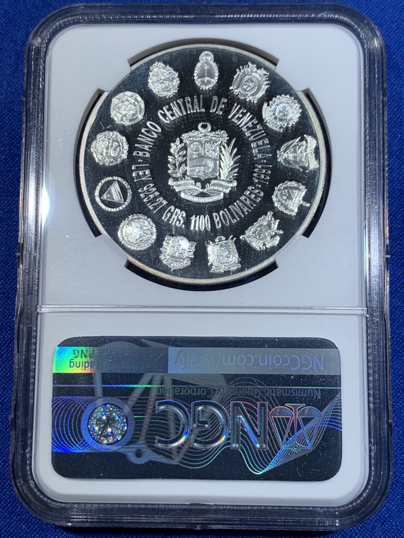 《竞宝斋》第263场-周日，周一 2场连拍 (全场包邮) NGC PF67UC 1991委内瑞拉1100玻利瓦尔银币，非常少见的委内瑞拉银币品种， 纪念哥伦布发现新大陆，正面是哥伦布全身像，背面是拉丁美洲各国国徽图案，委内瑞拉银币也是国际市场的热门品种，不容错过