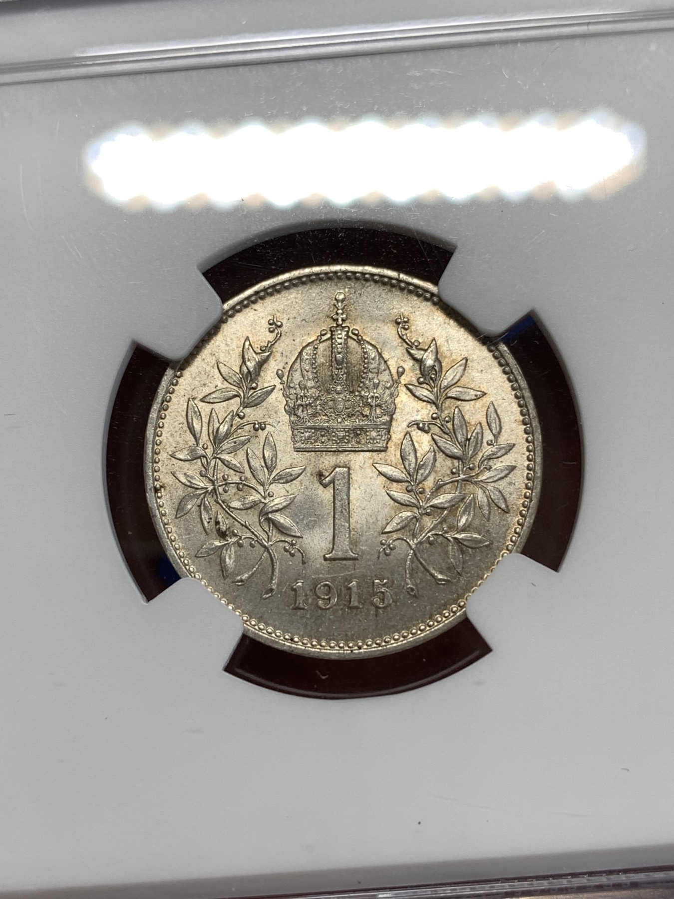 《竞宝斋》第263场-周日，周一 2场连拍 (全场包邮) NGC MS63 奥匈帝国1915年约瑟夫一世1克朗银币，金色包浆，十字转光