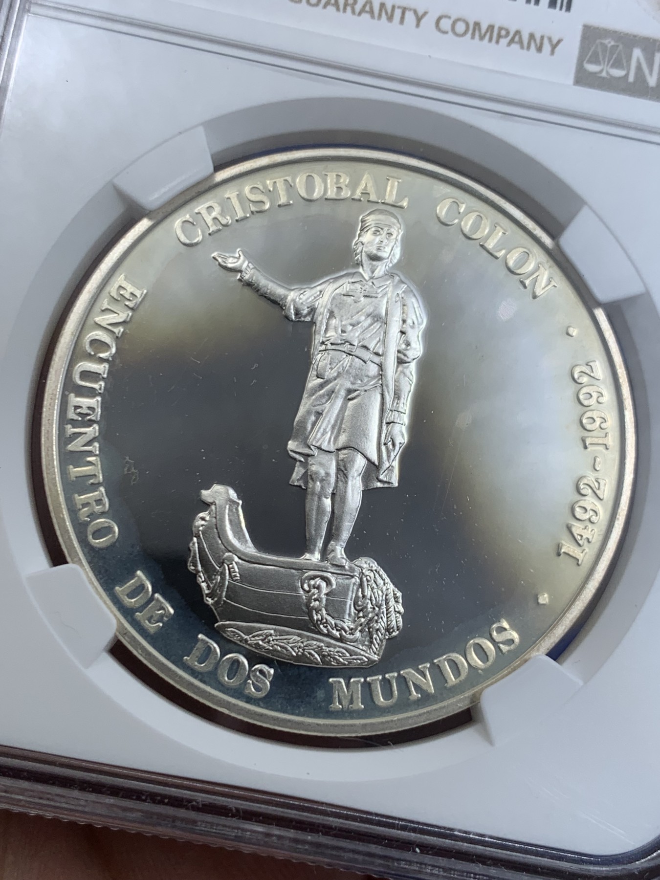 《竞宝斋》第263场-周日，周一 2场连拍 (全场包邮) NGC PF67UC 1991委内瑞拉1100玻利瓦尔银币，非常少见的委内瑞拉银币品种， 纪念哥伦布发现新大陆，正面是哥伦布全身像，背面是拉丁美洲各国国徽图案，委内瑞拉银币也是国际市场的热门品种，不容错过