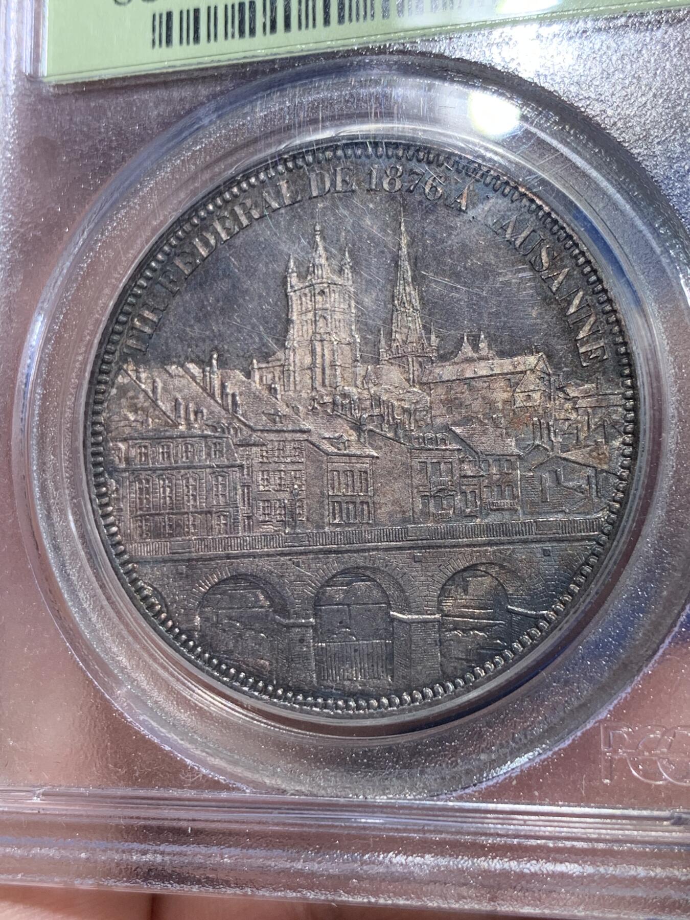 《竞宝斋》立夏专场特拍 （第2-1场）全场顺丰包邮 265场 PCGS MS63 瑞士1876年洛桑射击节5法郎银币 PCGS经典绿标 现在这种盒子市面上已经绝迹 老盒低评 64分状态 人物景观细节俱在