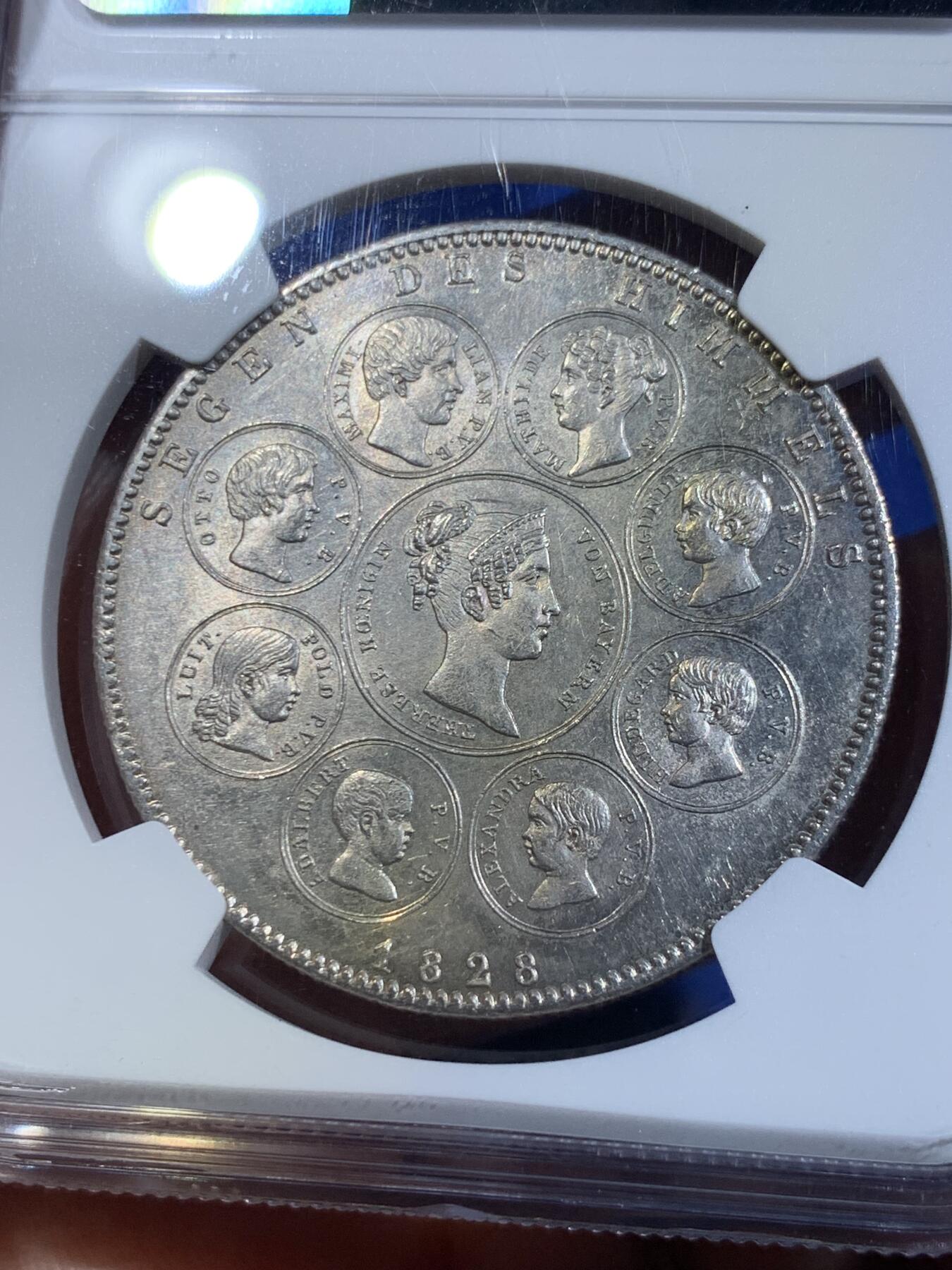《竞宝斋》立夏专场特拍 （第2-1场）全场顺丰包邮 265场 NGC UNC 德国1828巴伐利亚纪念泰勒大银币 正面皇帝 背面是特蕾莎皇后和8个子女 寓意非常好 祝福王室 细节很好 非常经典和精美