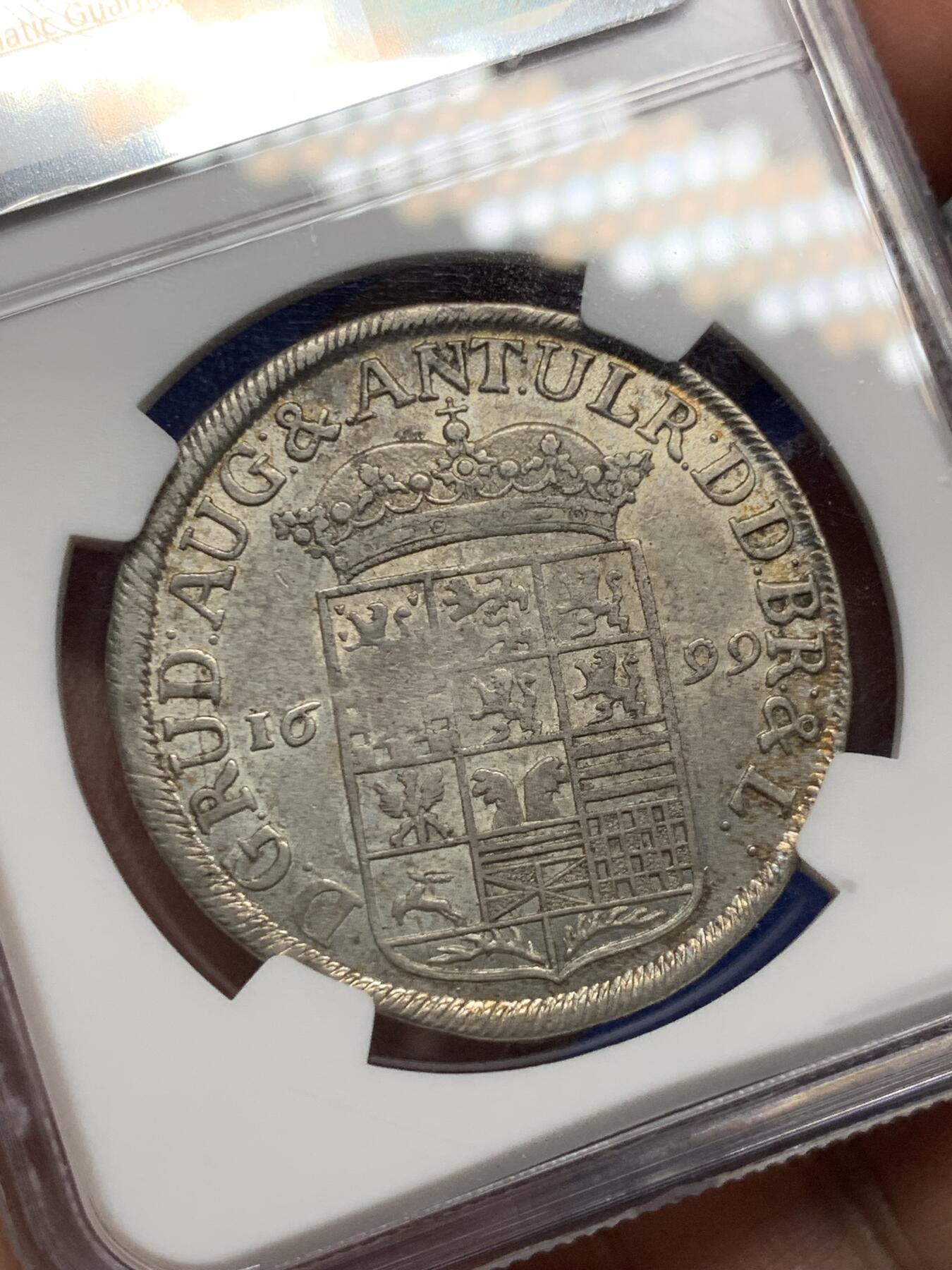 《竞宝斋》立夏专场特拍 （第2-1场）全场顺丰包邮 265场 NGC AU58 德国 1699年 布伦瑞克 飞马 2/3泰勒银币 带包浆 很不错