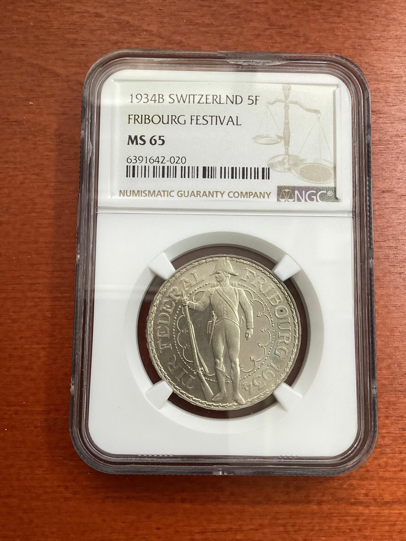 长老汇龙年精选第四场 1934B 瑞士弗莱堡射击节5法郎银币，NGC MS65分，官网63分100美金