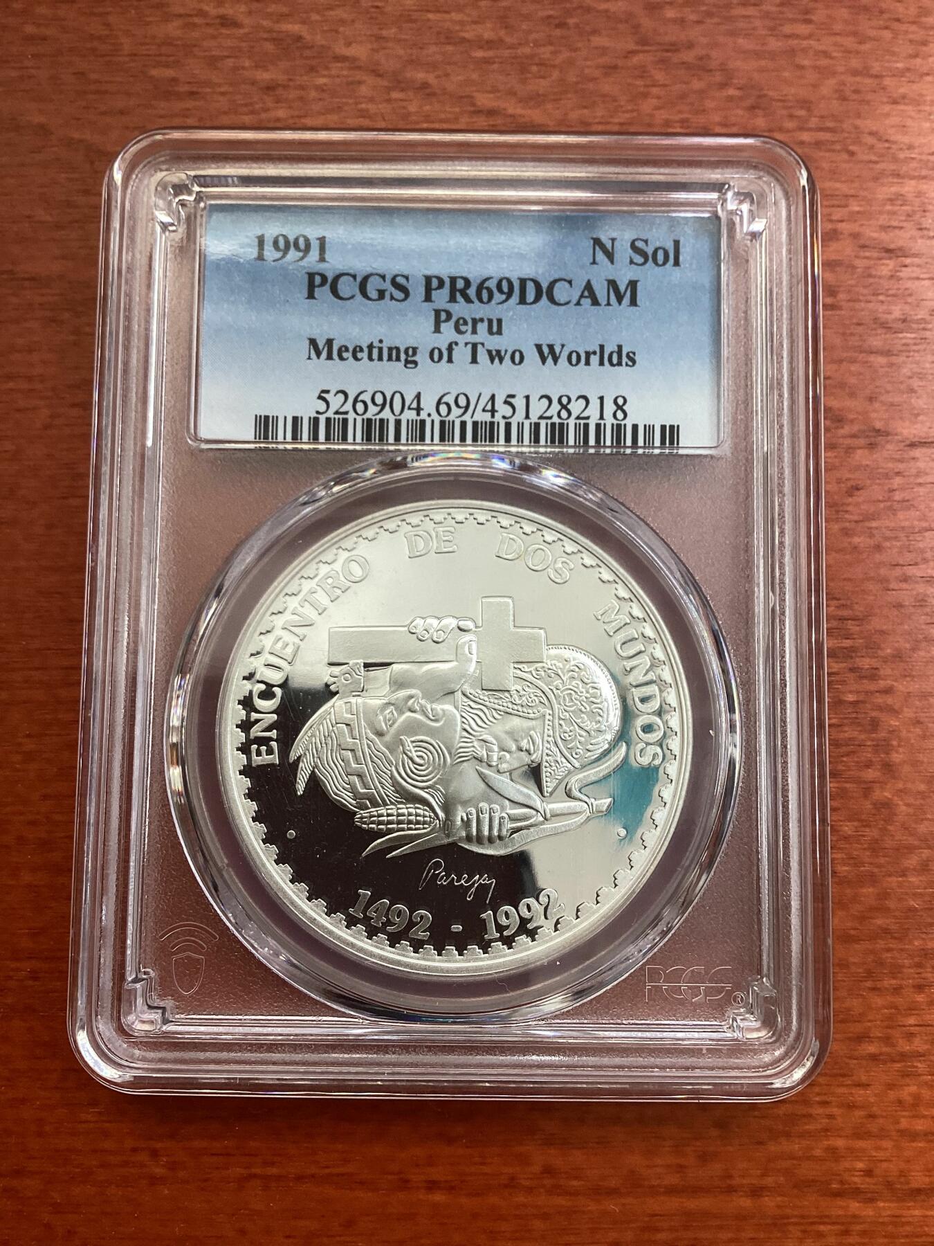长老汇龙年精选第四场 1991 秘鲁发现美洲1索尔精制银币，PCGS PR69DCAM，七枚冠军分之一