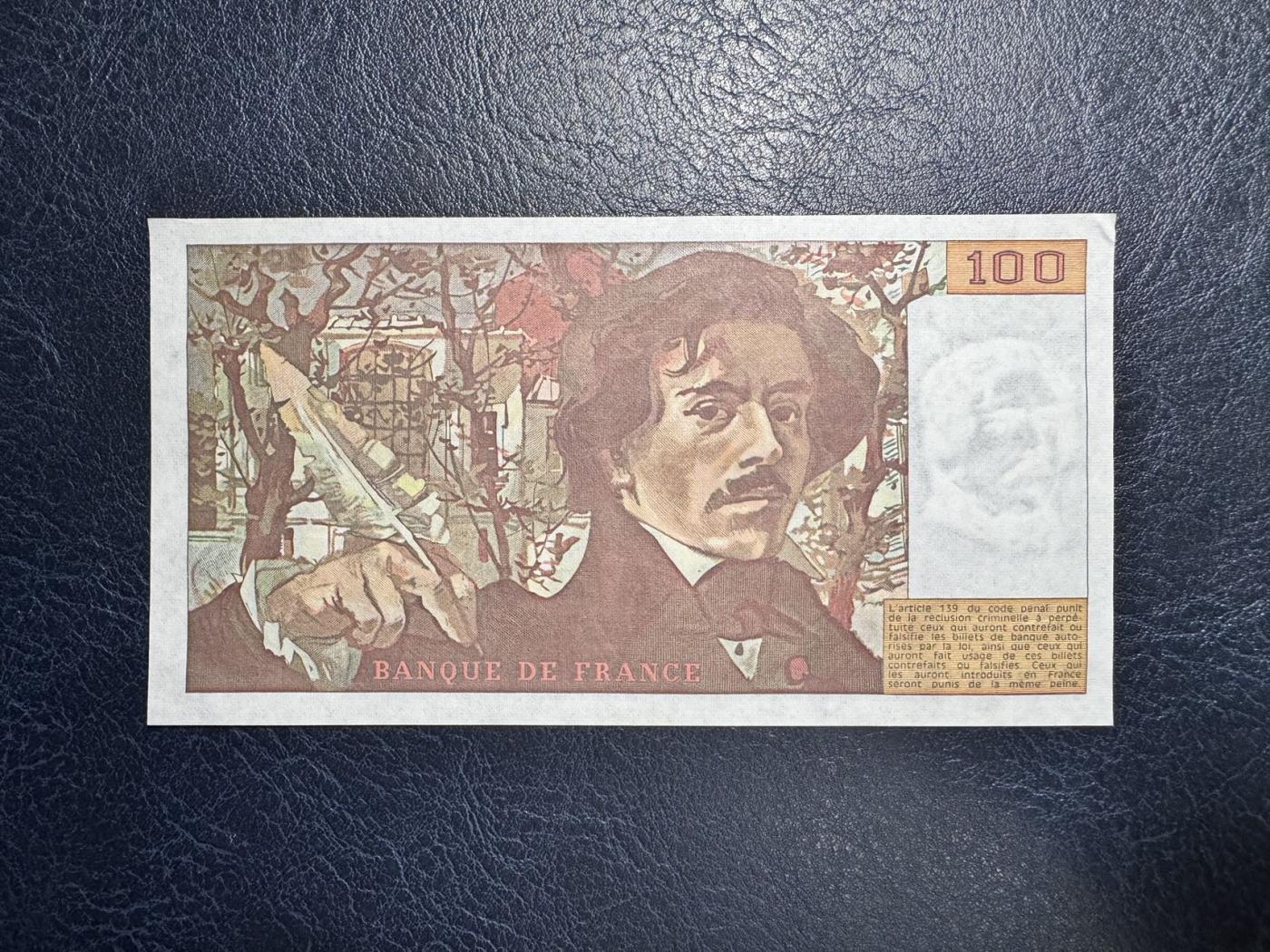 收藏联盟Quantum Auction 第346期拍卖  法国1982年100法郎 品相UNC-  票面边缘有轻微夹痕和角有瑕疵 自由引导人民 早期年份