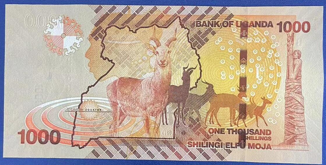 【炜奕收藏】世界精选纸币裸钞专场 2015年乌干达1000先令，UNC-品相，左边出厂裁切不均匀，号码数3无47，夹豹子号