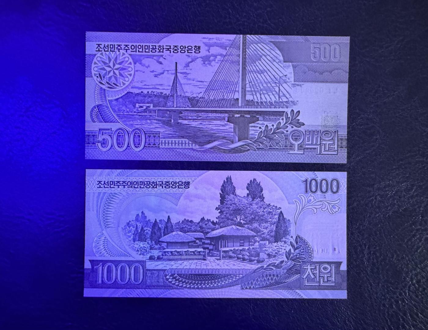 收藏联盟Quantum Auction 第347期拍卖  朝鲜1998年500元和2002年1000-5000元建国60周年纪念钞样票 品相全新UNC 