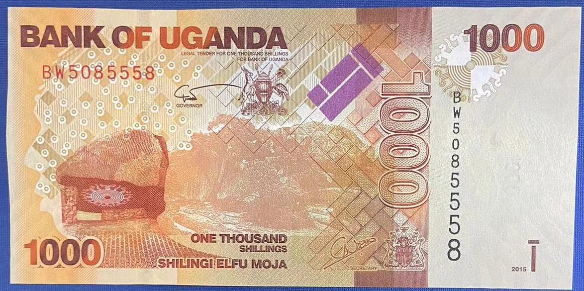 【炜奕收藏】世界精选纸币裸钞专场 2015年乌干达1000先令，UNC-品相，左边出厂裁切不均匀，号码数3无47，夹豹子号