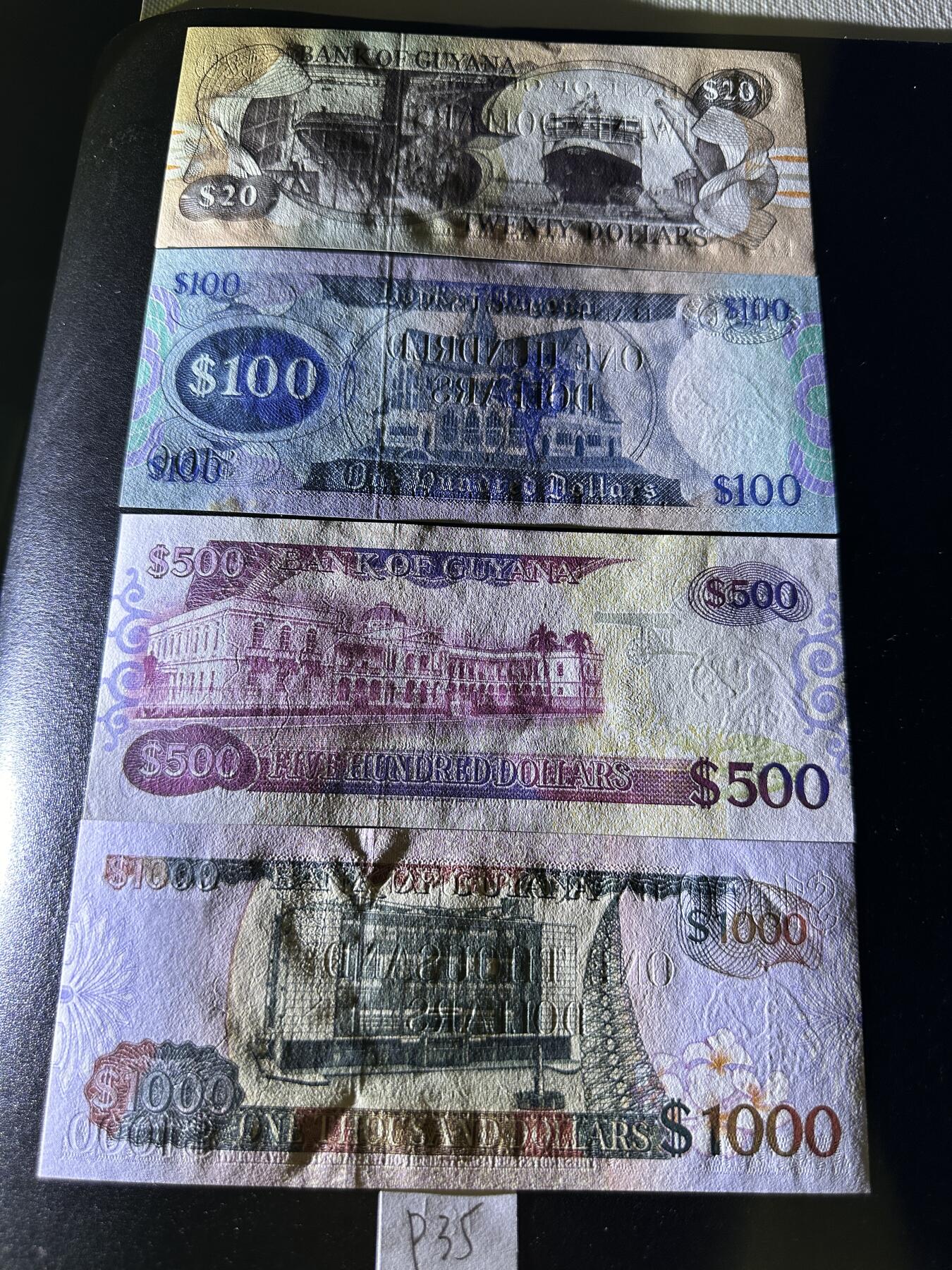 《外钞收藏家》第三百七十期（美洲纸币+其他） 圭亚那混合版，20/100/500/1000元，4枚	P27-28/32/35 全新