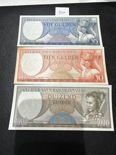 《外钞收藏家》第三百七十期（美洲纸币+其他） - 苏里南1963年版套币，5/10/1000盾，3枚	P120-124 一张有黄 其他全新